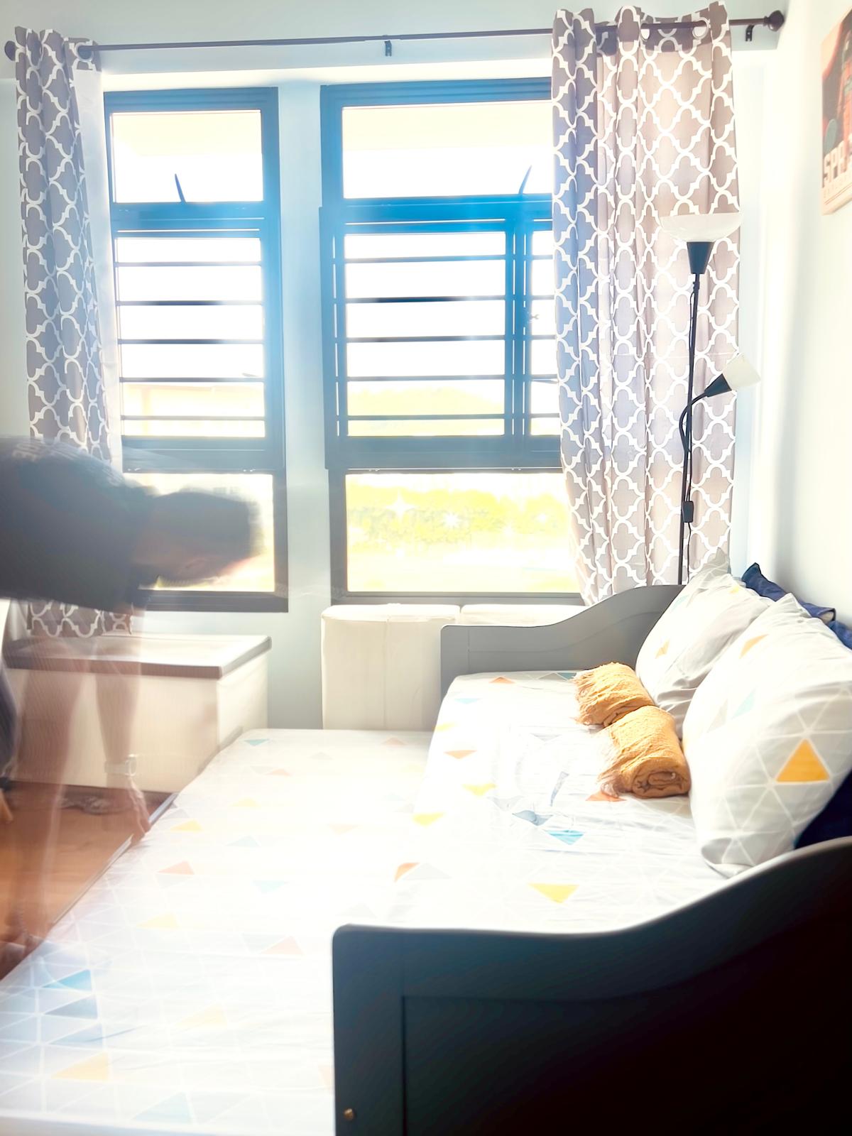 Airy and Inviting: A $26K Bohemian Mediterranean 4-RM BTO - Bright window with blue frames, patterned curtains, sunlight