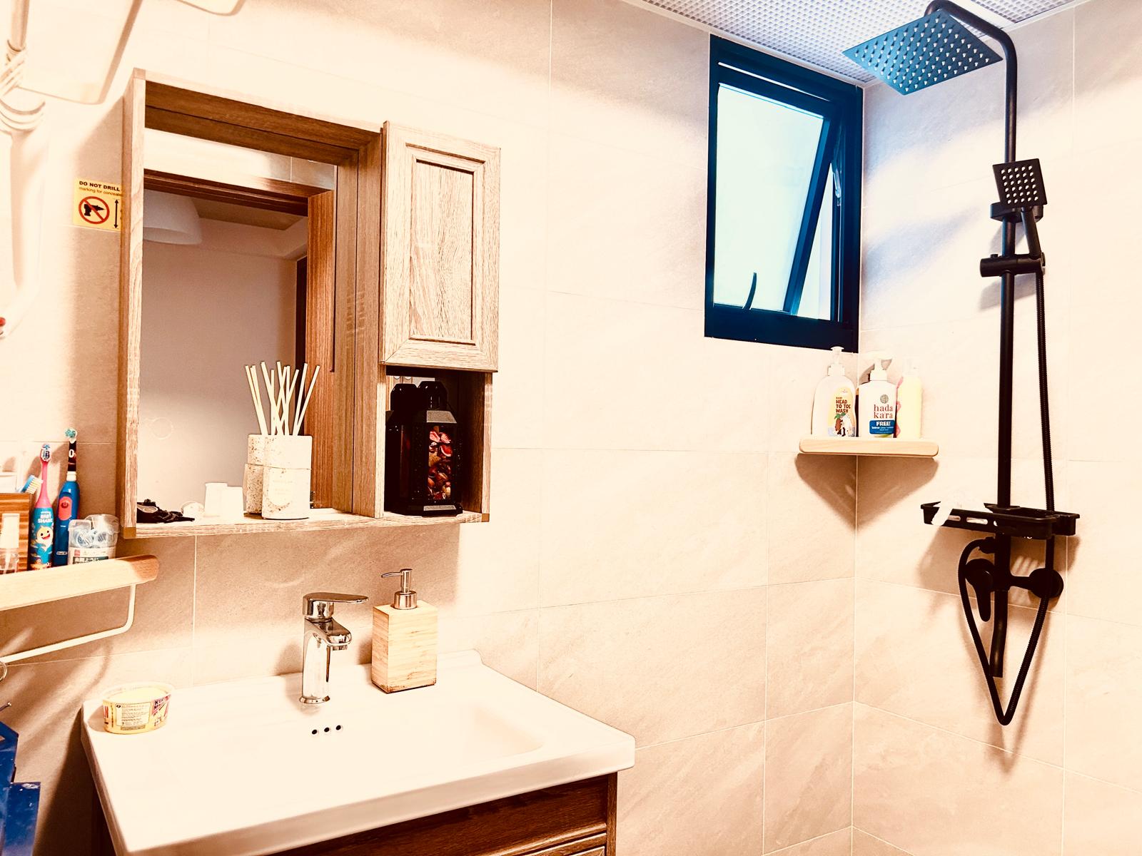 Airy and Inviting: A $26K Bohemian Mediterranean 4-RM BTO - Wooden-framed mirror, bathroom vanity, white sink, wooden