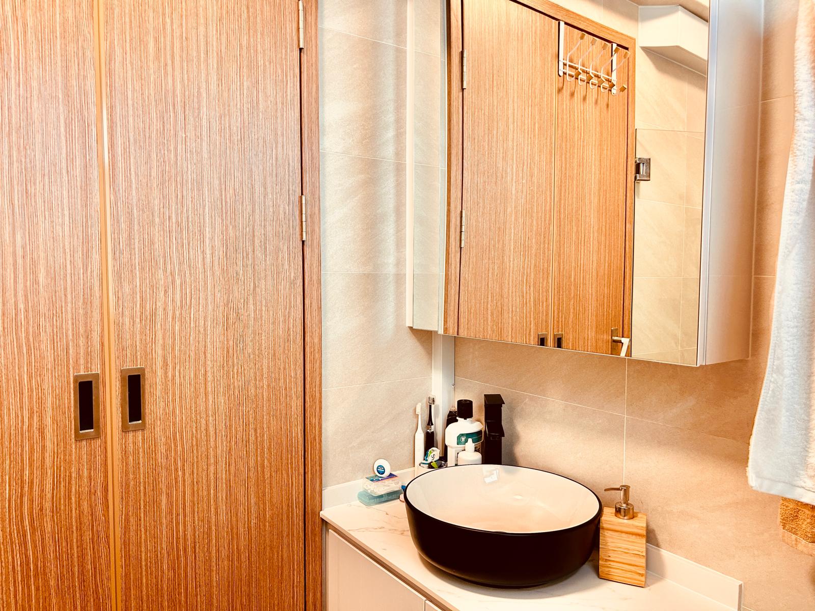 Airy and Inviting: A $26K Bohemian Mediterranean 4-RM BTO - Wooden bathroom cabinet, beige tiled walls, modern bathroom