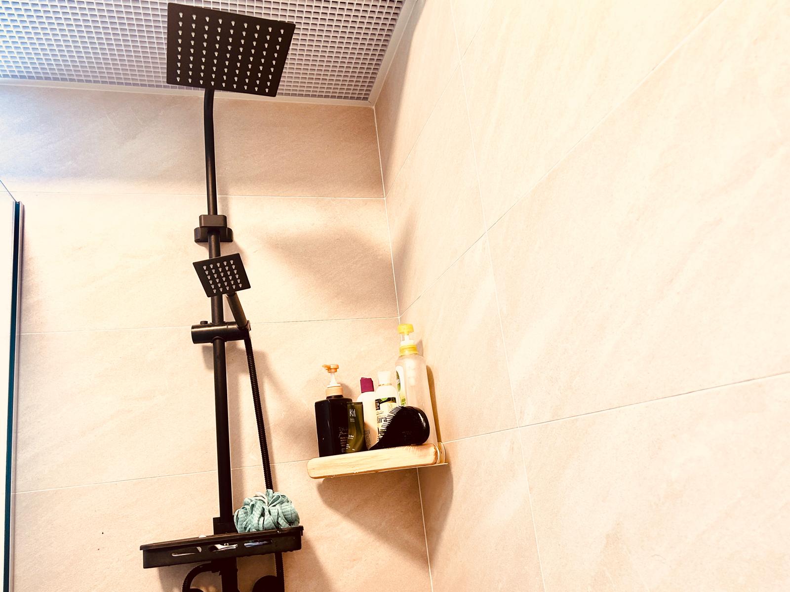 Airy and Inviting: A $26K Bohemian Mediterranean 4-RM BTO - shower rack, black showerhead, beige tiles, bathroom shelf