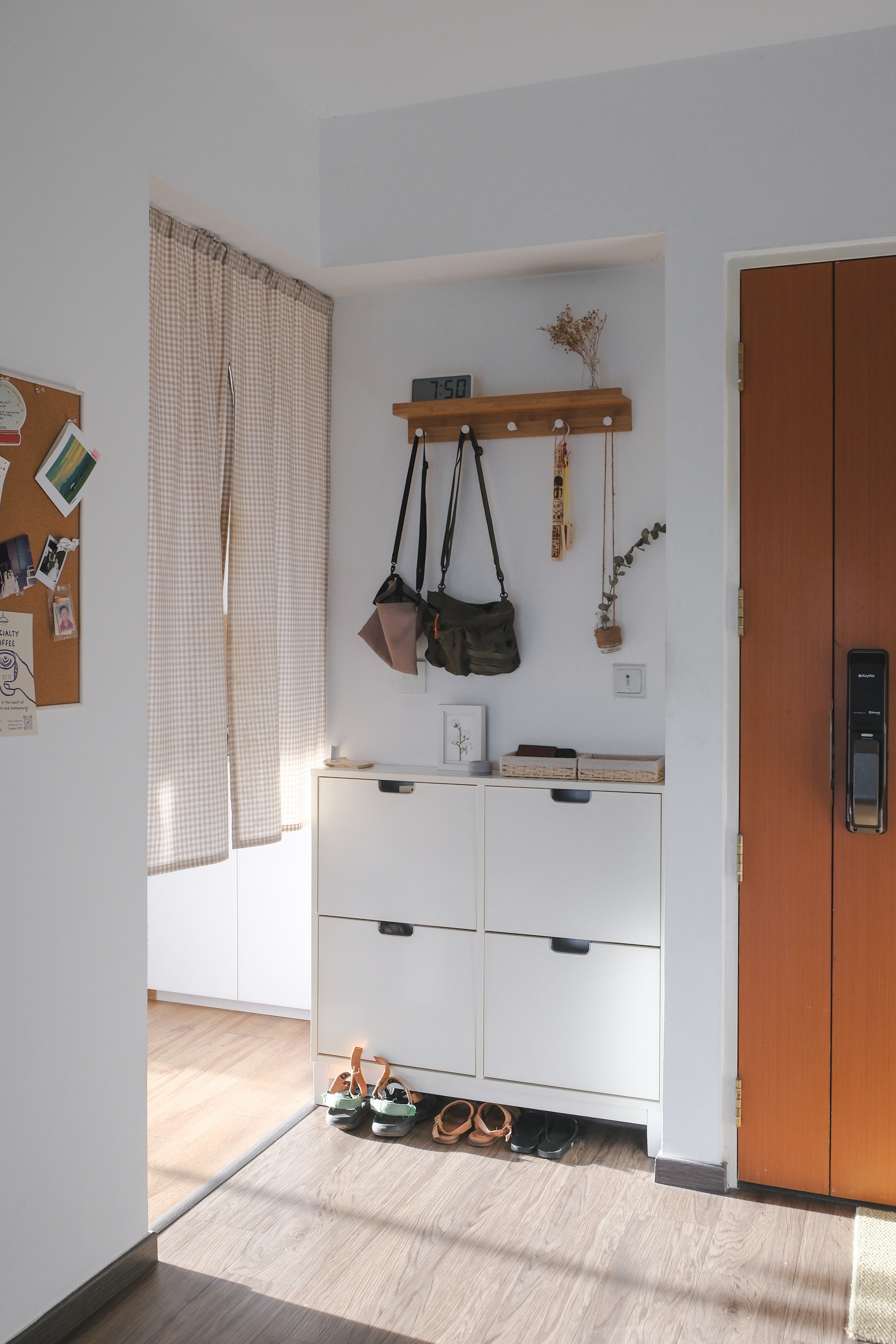 Japandi HDB Home with Unblocked Views: Renovated for Just $15K! - White wooden cabinet, neatly organized shoes, wooden floor