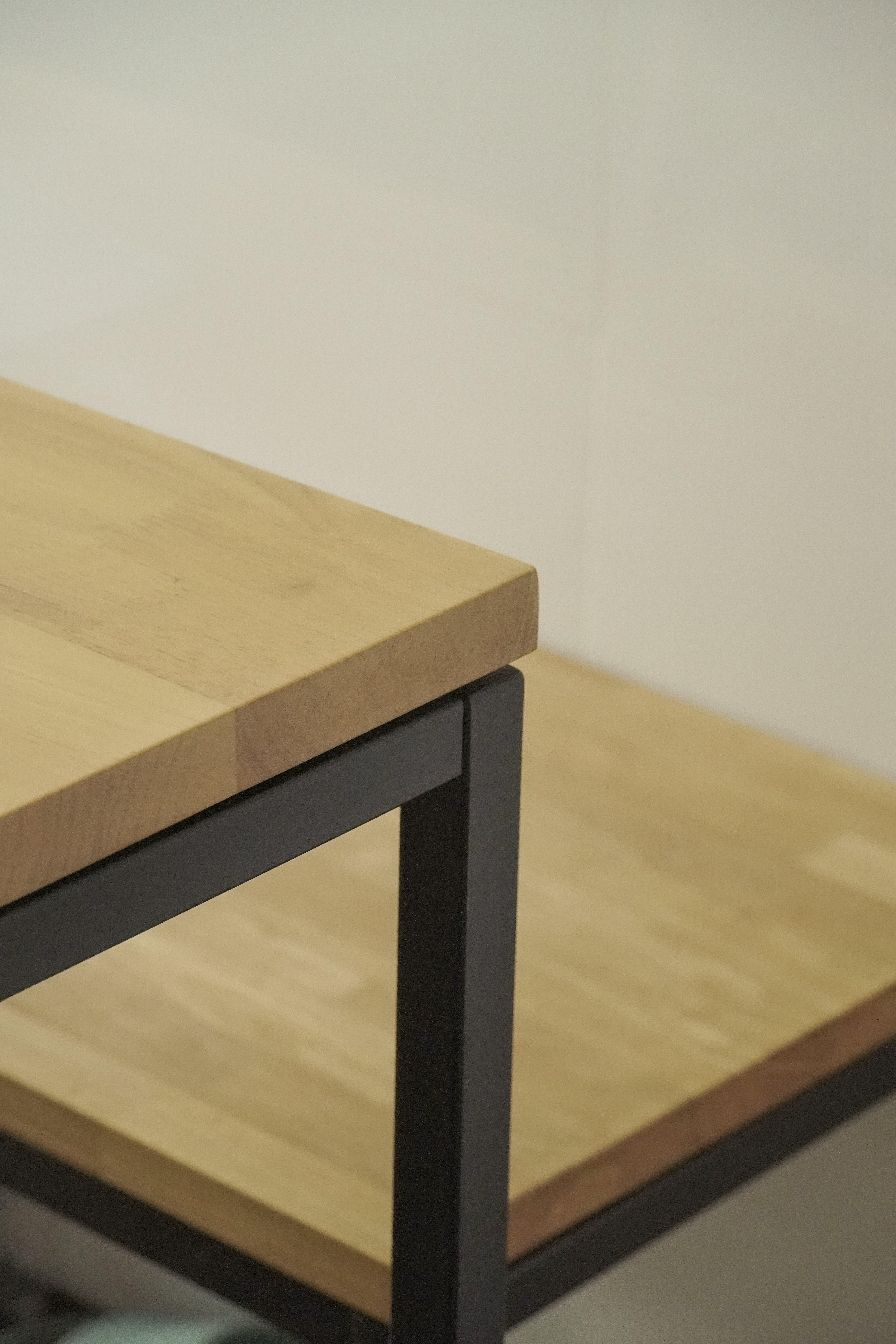 Living in Shared Spaces | Long Kitchen Design of a 5RM Resale - Light wood table with black metal legs, minimalist design