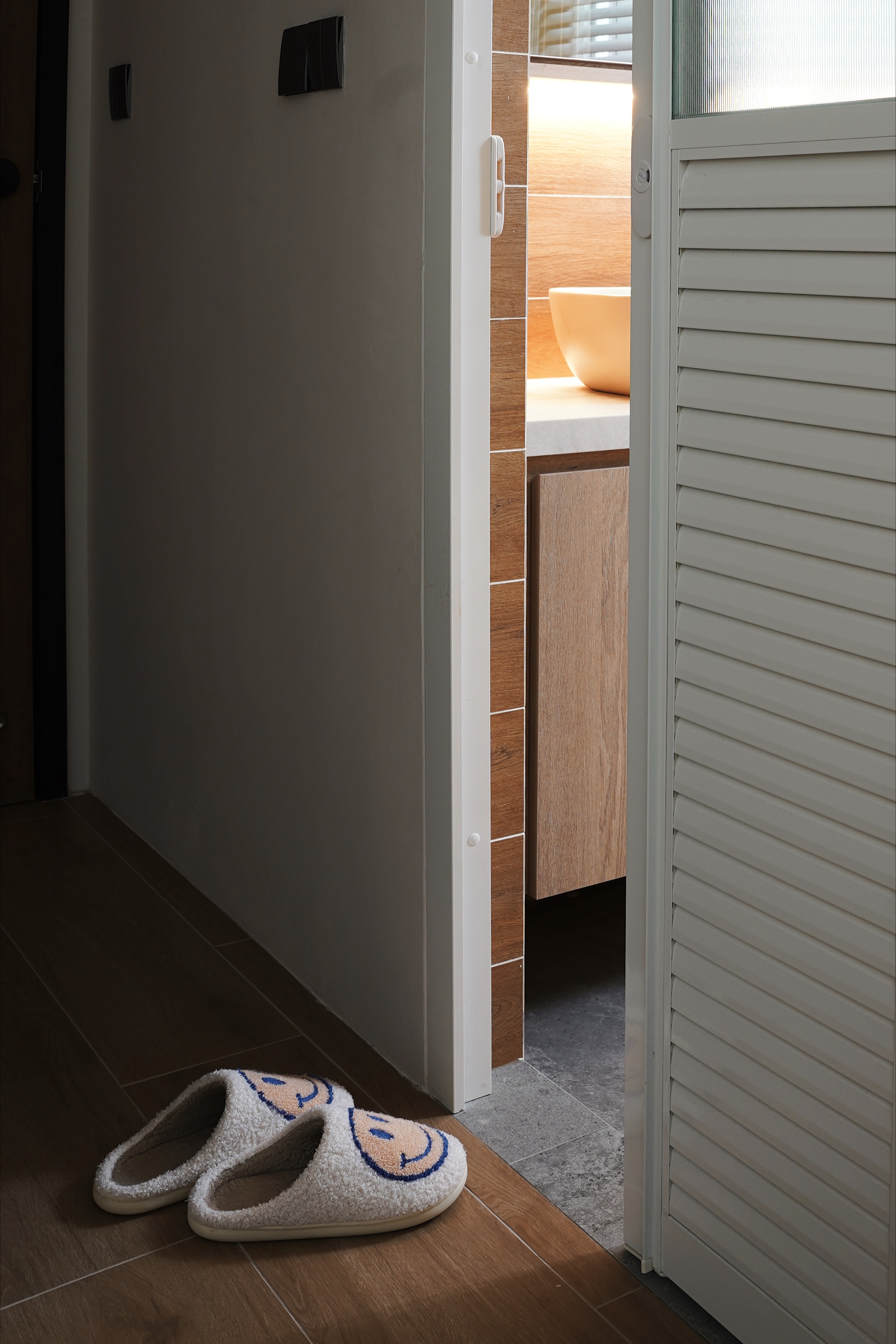 Master Bedroom Hacks: Walk-in wardrobe & dedicated rest area - Slippers, wooden floor, doorway, light-colored walls