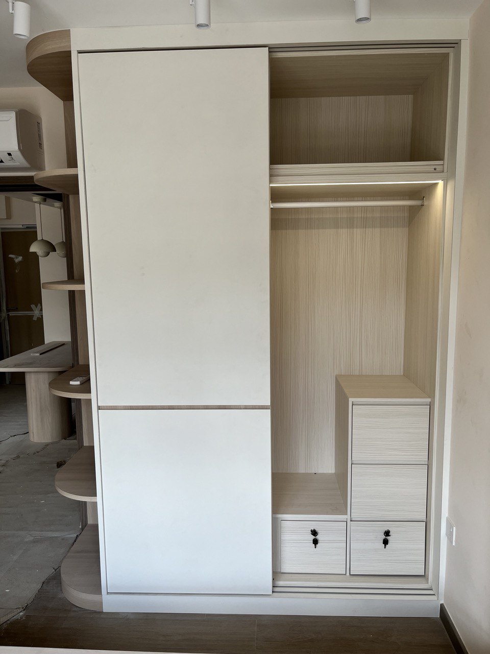 Before & After: Queen-Sized Storage Platform Bed in the Common Room? - Wooden wardrobe with open doors, minimalist design