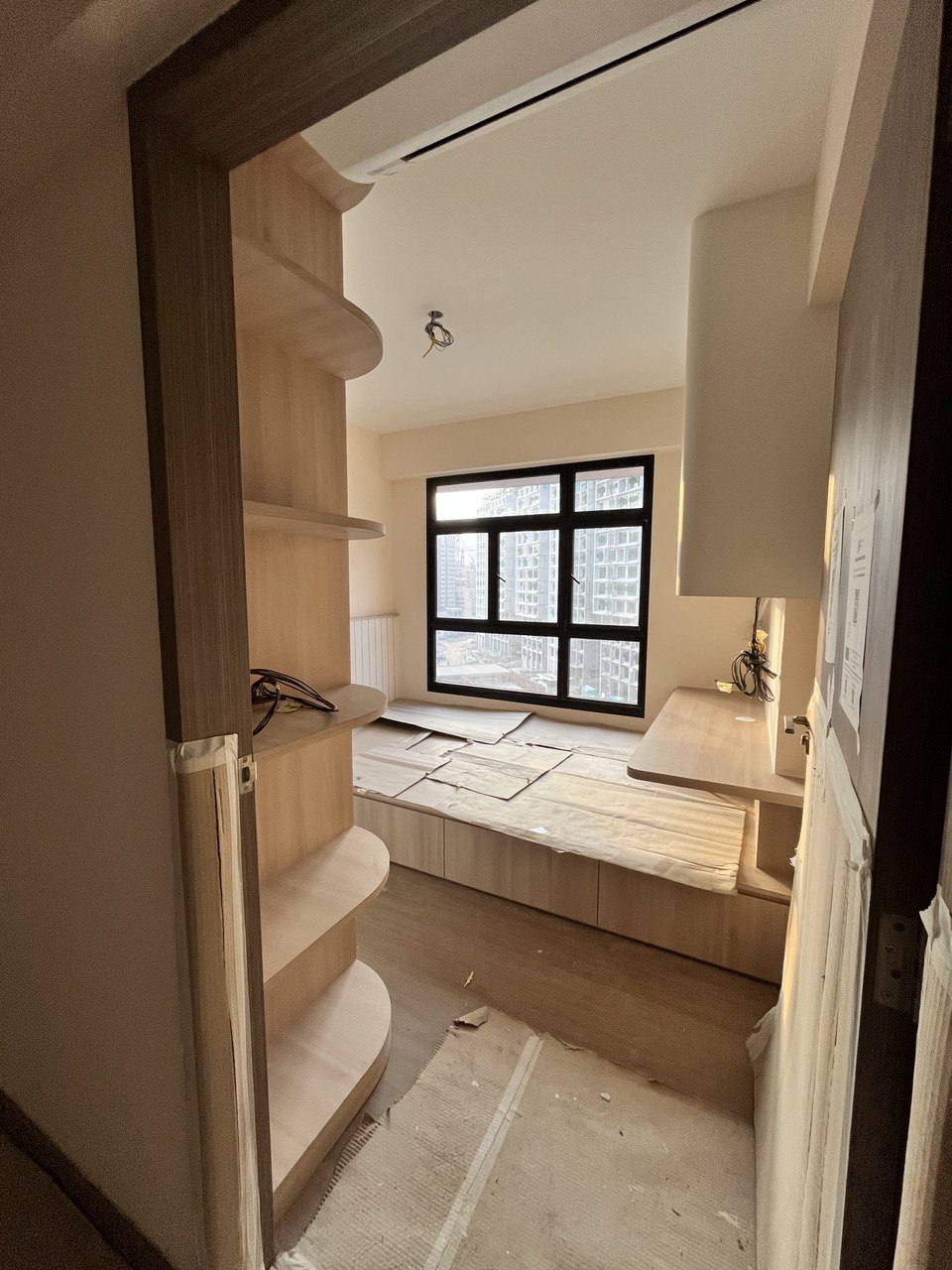 Before & After: Queen-Sized Storage Platform Bed in the Common Room? - Wooden shelving unit, unfinished room, interior