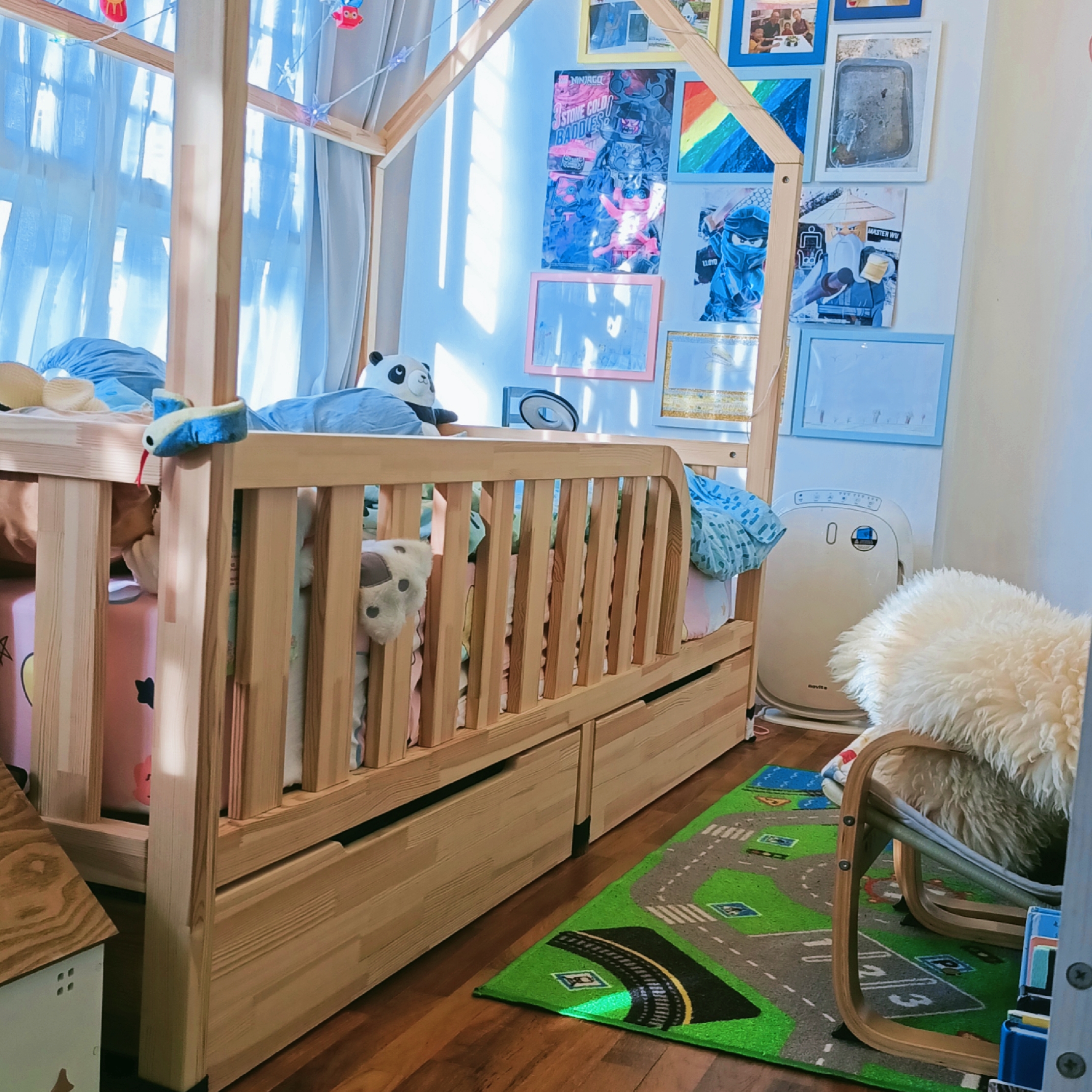 26K Cozy Rustic Home with Swing and Study Corridor - Wooden crib with blue and pink bedding, plush toys, colorful artwork on