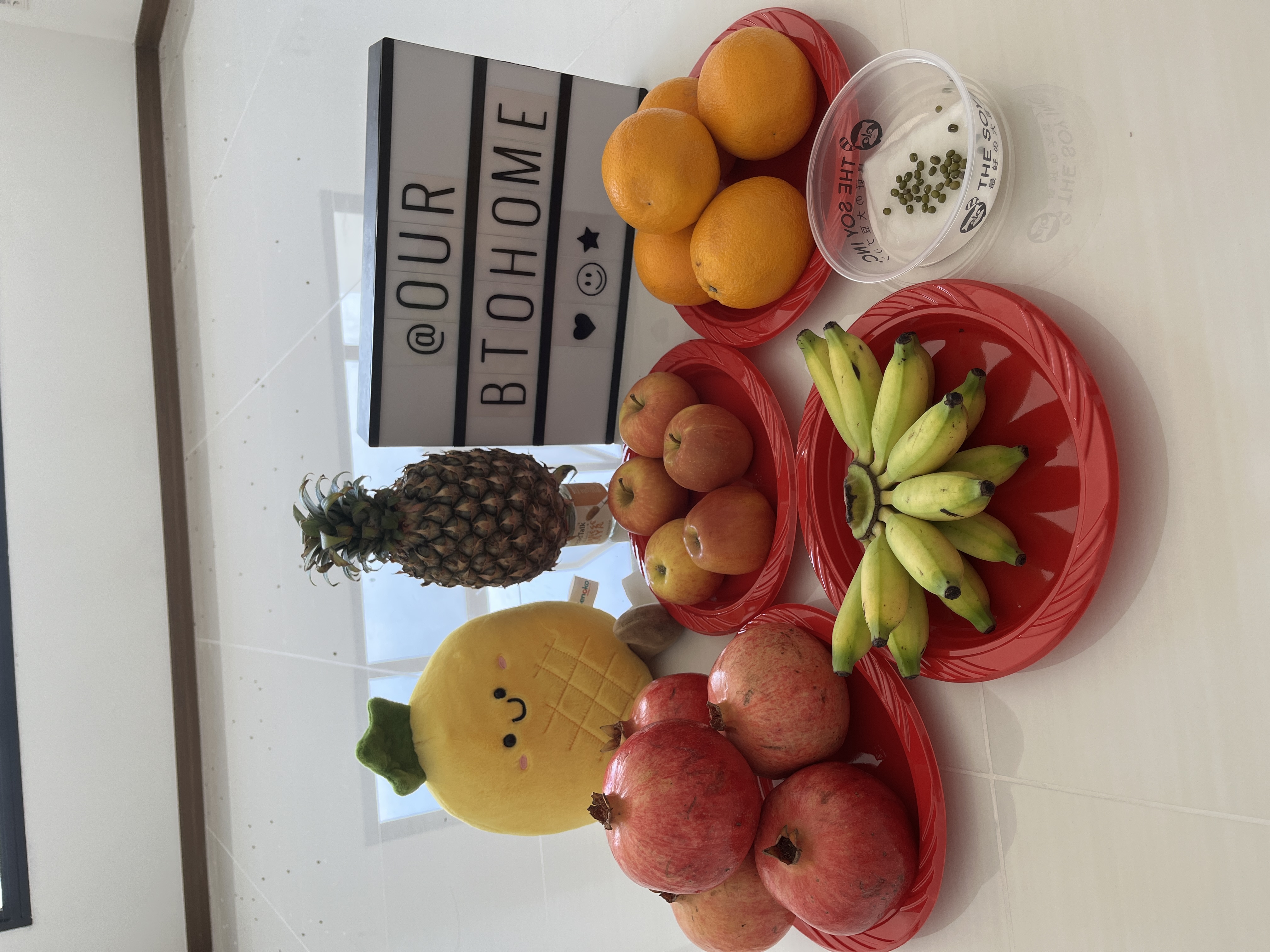 House Hunting: Our BTO Journey!  - Oranges, pears, pomegranates, bananas, pineapple, red plates, white background, bright