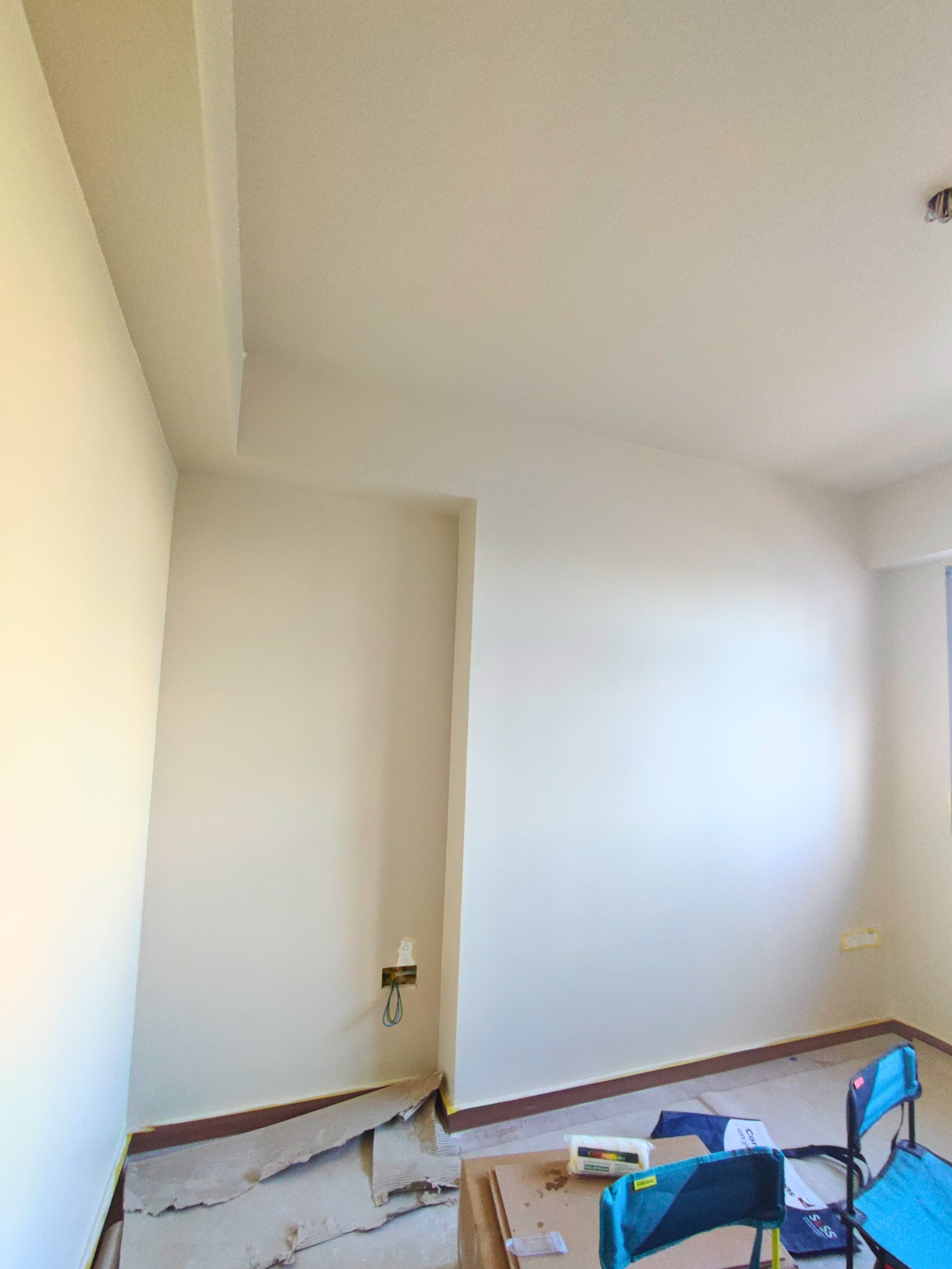 The Evolution Of My Home Gym From A Makeshift Kitchen - White-painted walls and unfinished ceiling, Minimalist room with