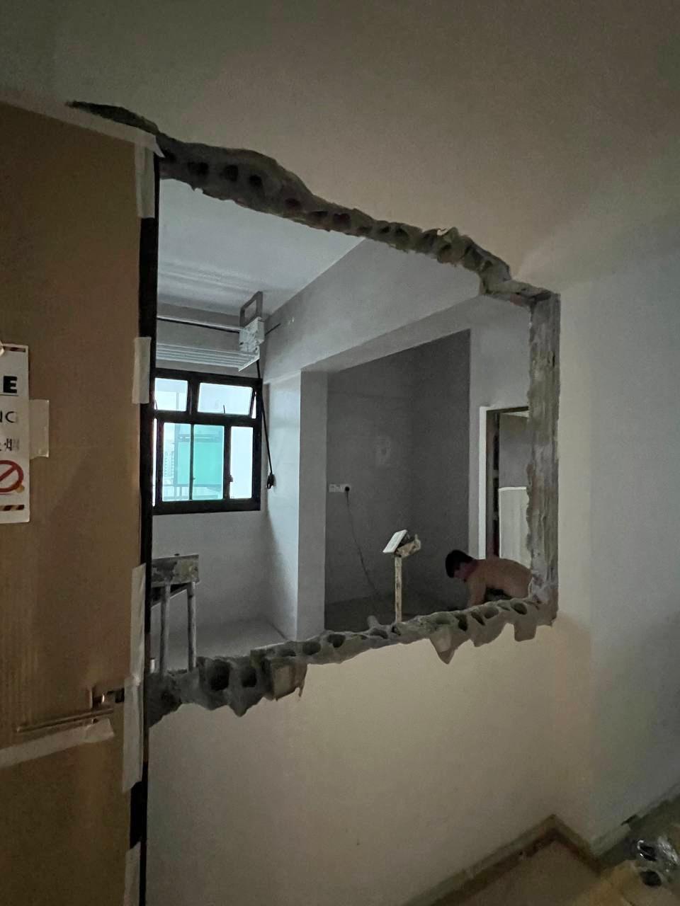 House Tour: Minimalist Home Reno for S$37K | Tampines - Construction site with exposed framing and incomplete walls, Man