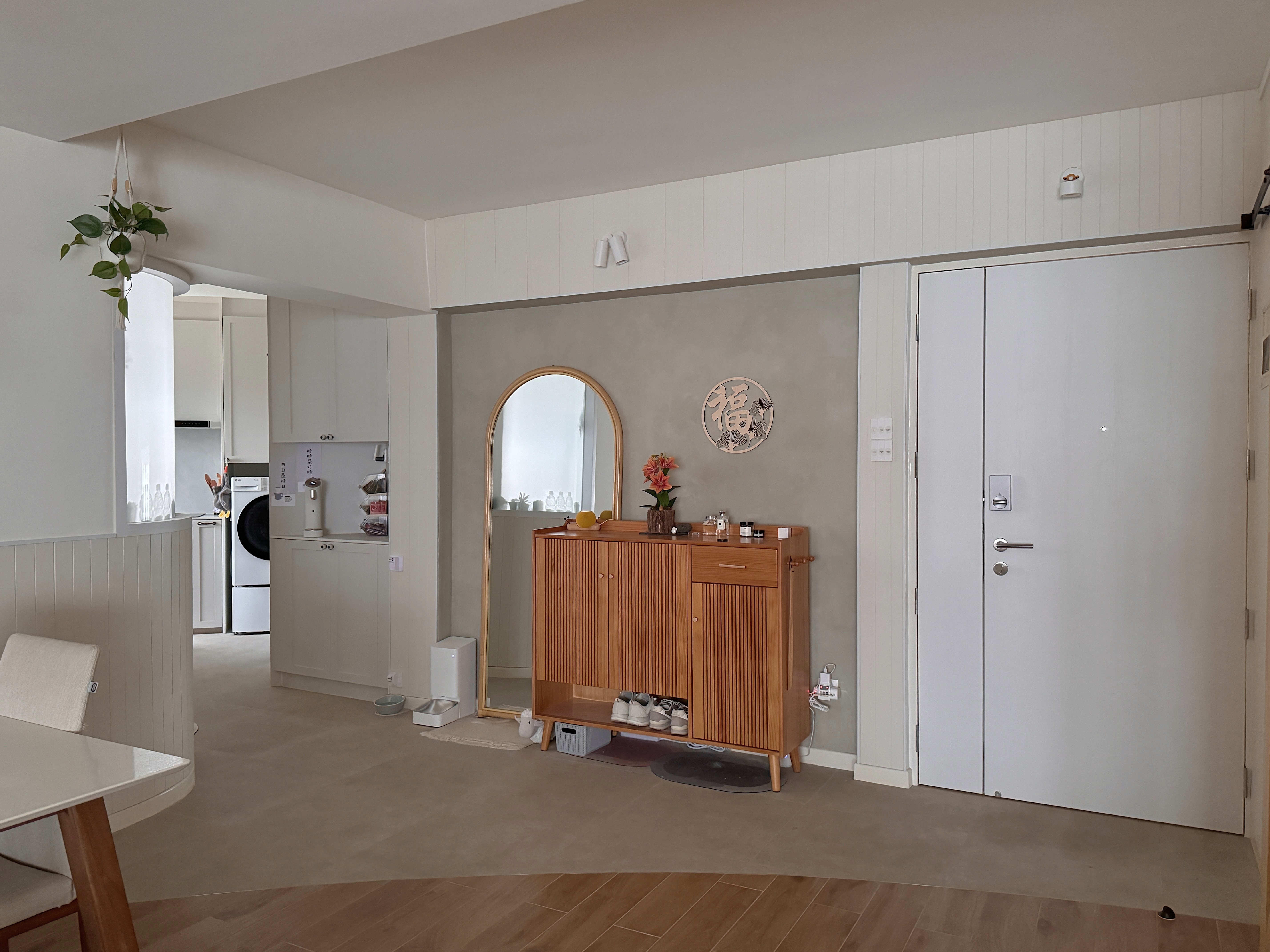 130K 5-room HDB Resale Home Tour: Warm hues, Panels, Barn door - White kitchen with wooden cabinet, hanging plant, modern