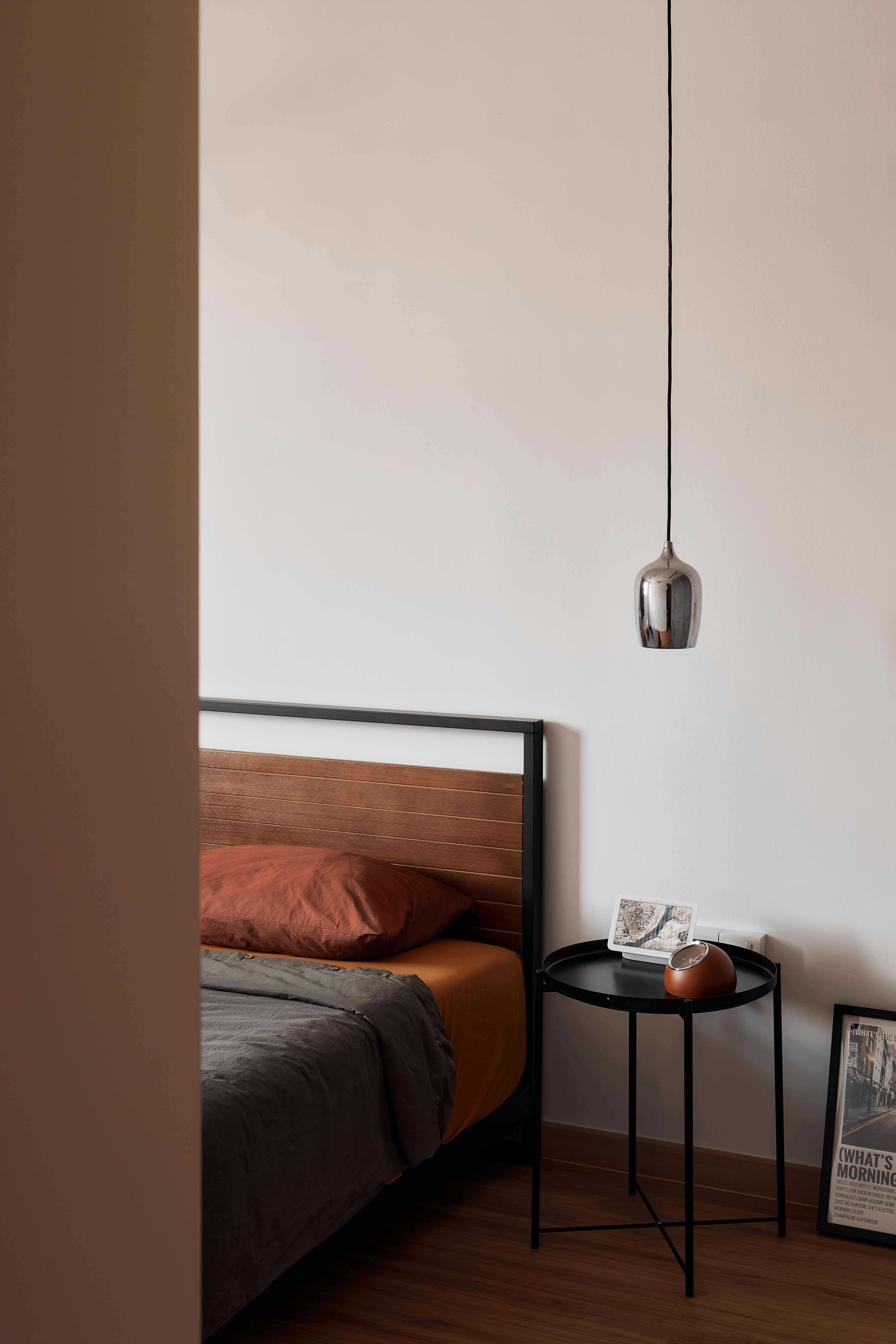 Before & After: Creating a Cozy Bedroom - Modern minimalist bedroom, cozy bed with orange and gray bedding, wooden headboard