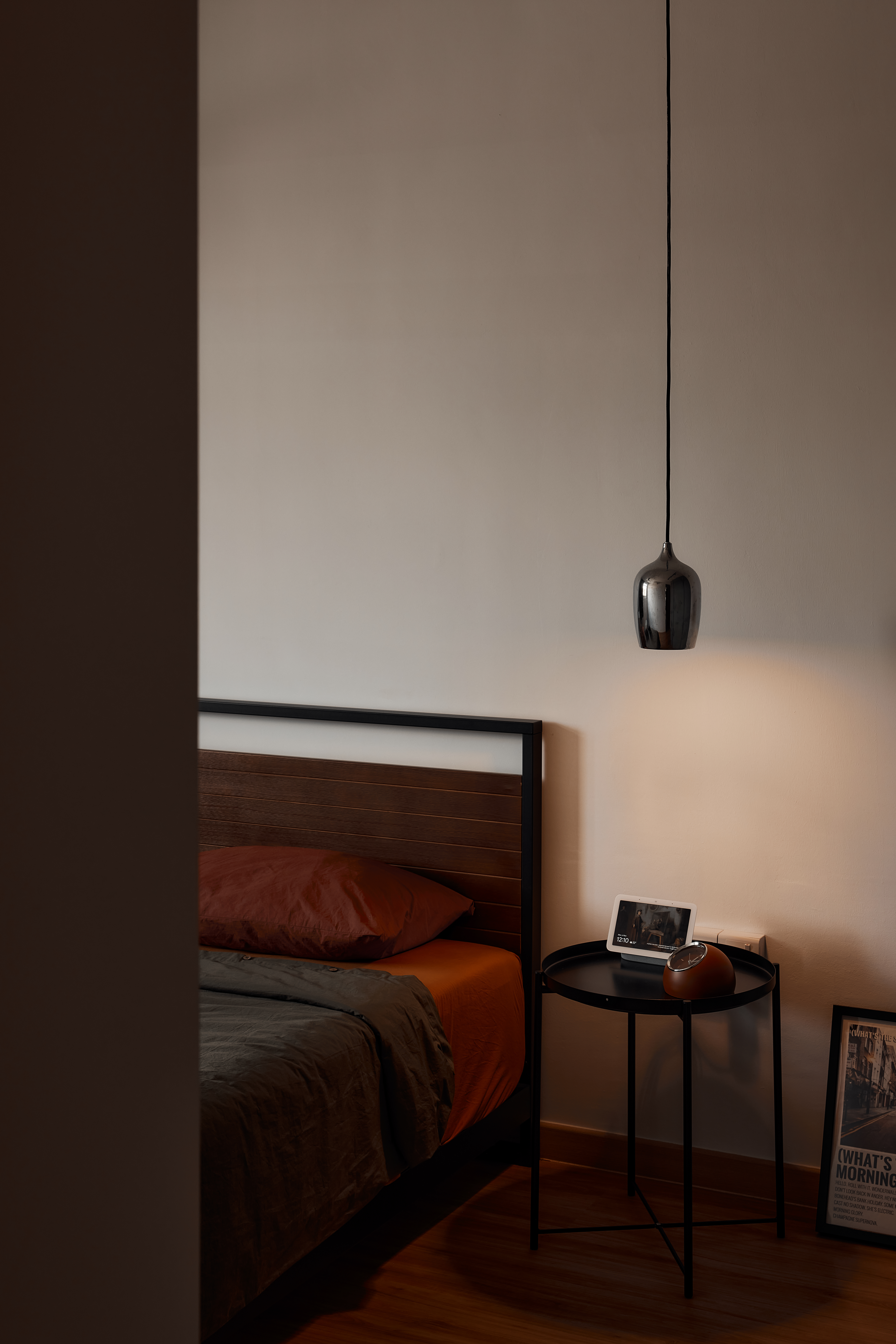 Before & After: Creating a Cozy Bedroom - Modern minimalist bedroom, cozy bed with orange and gray bedding, black metal
