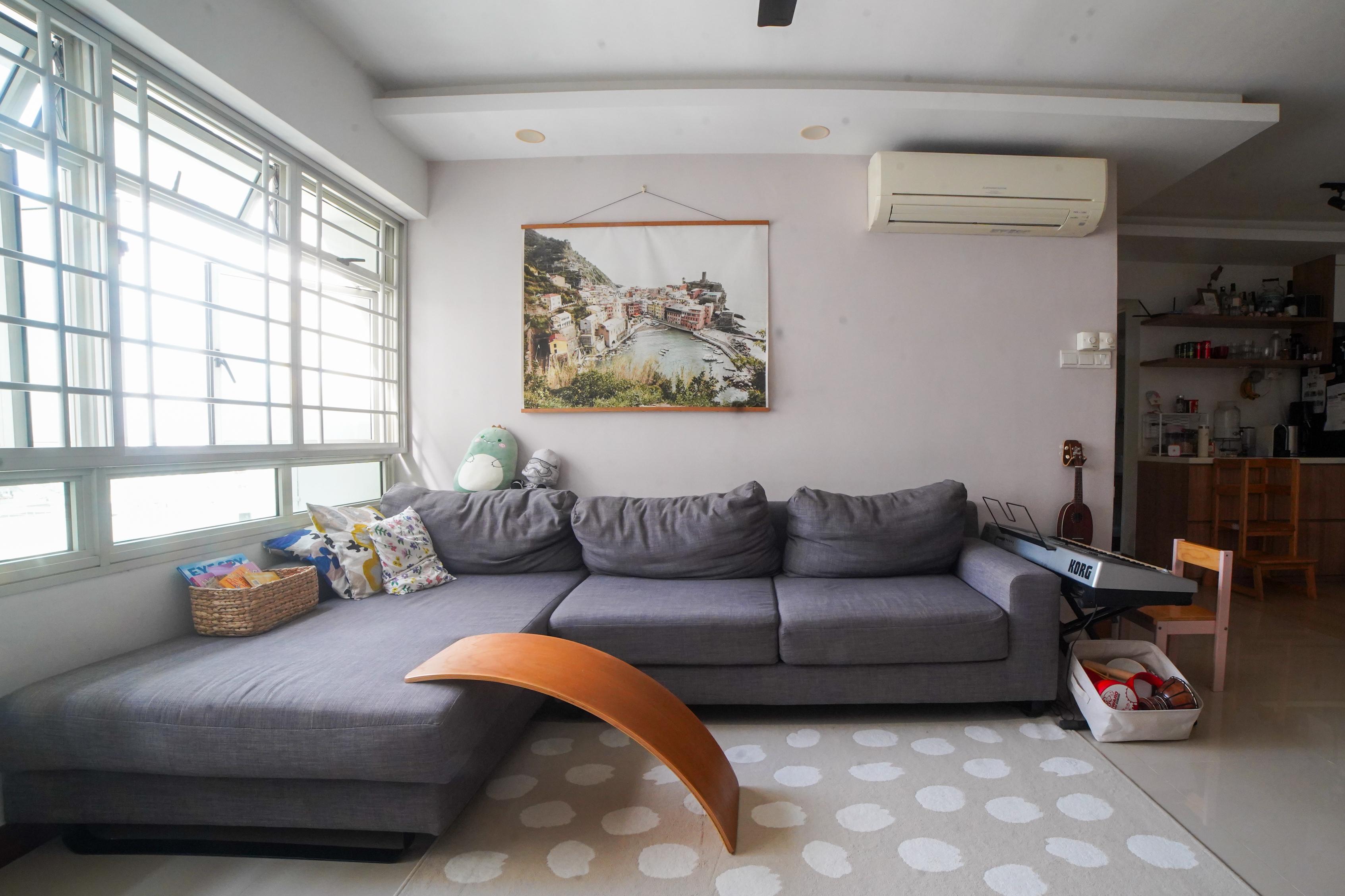 Home Tour: What a flat in Seng Kang looks like 8 years after reno - Grey sofa, large window, colorful pillows, wicker basket