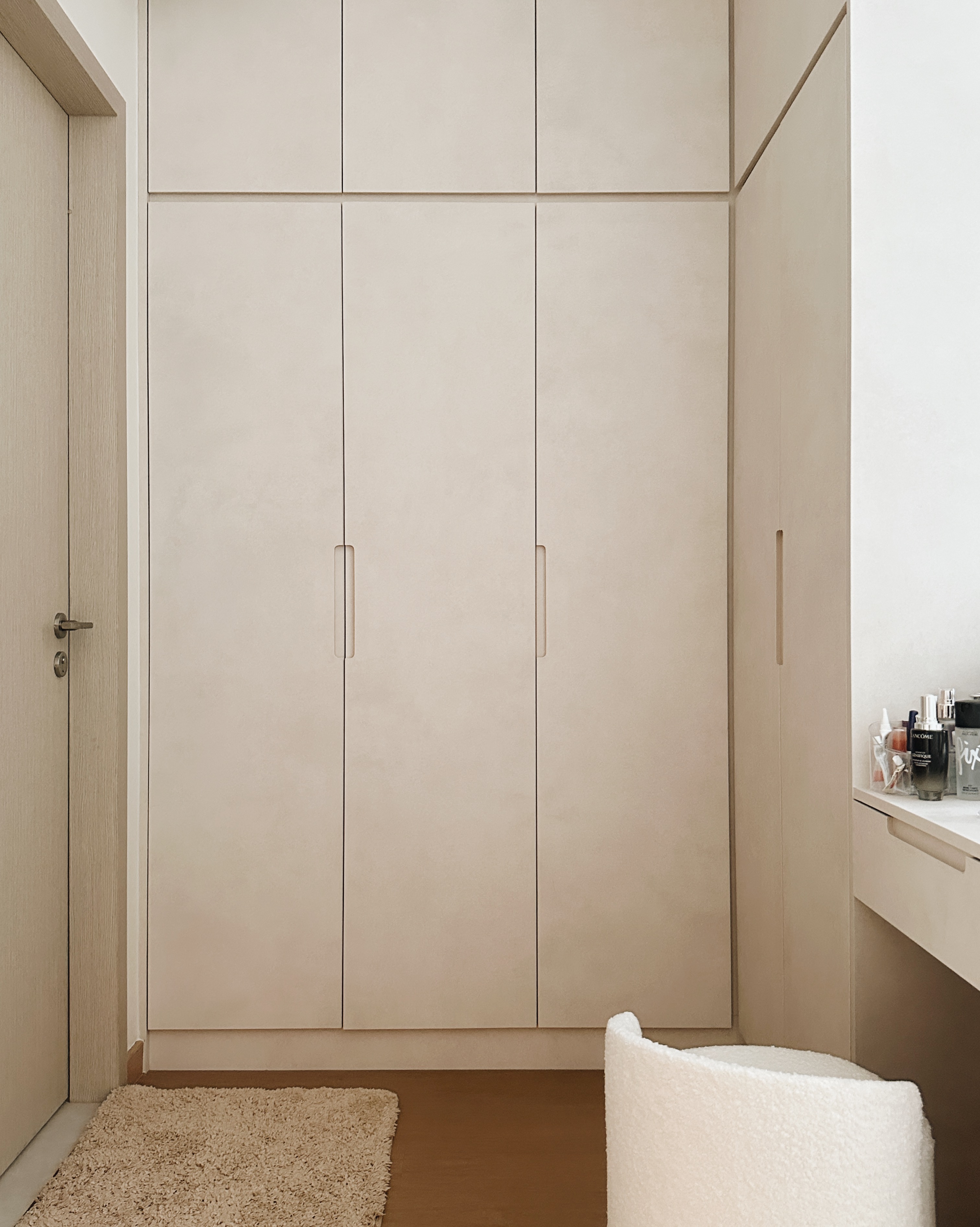 Inside a Warm Minimalist 3-Bedder Condo - Light beige wooden wardrobe, minimalist design, built-in shelving, soft natural
