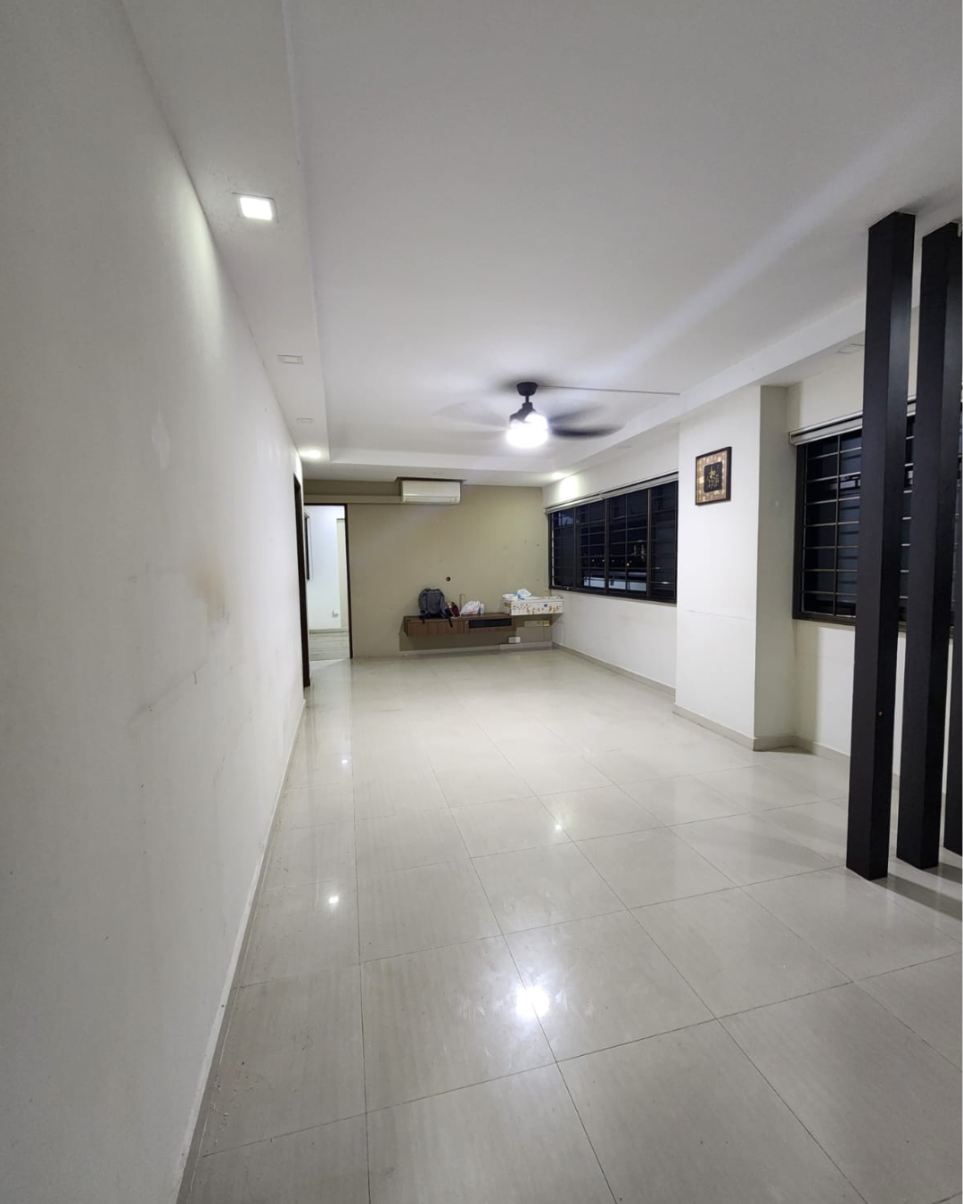 From Before to After: Our Common Area Glow-Up - Clean, minimalist hallway with white walls and light-colored tiled floor