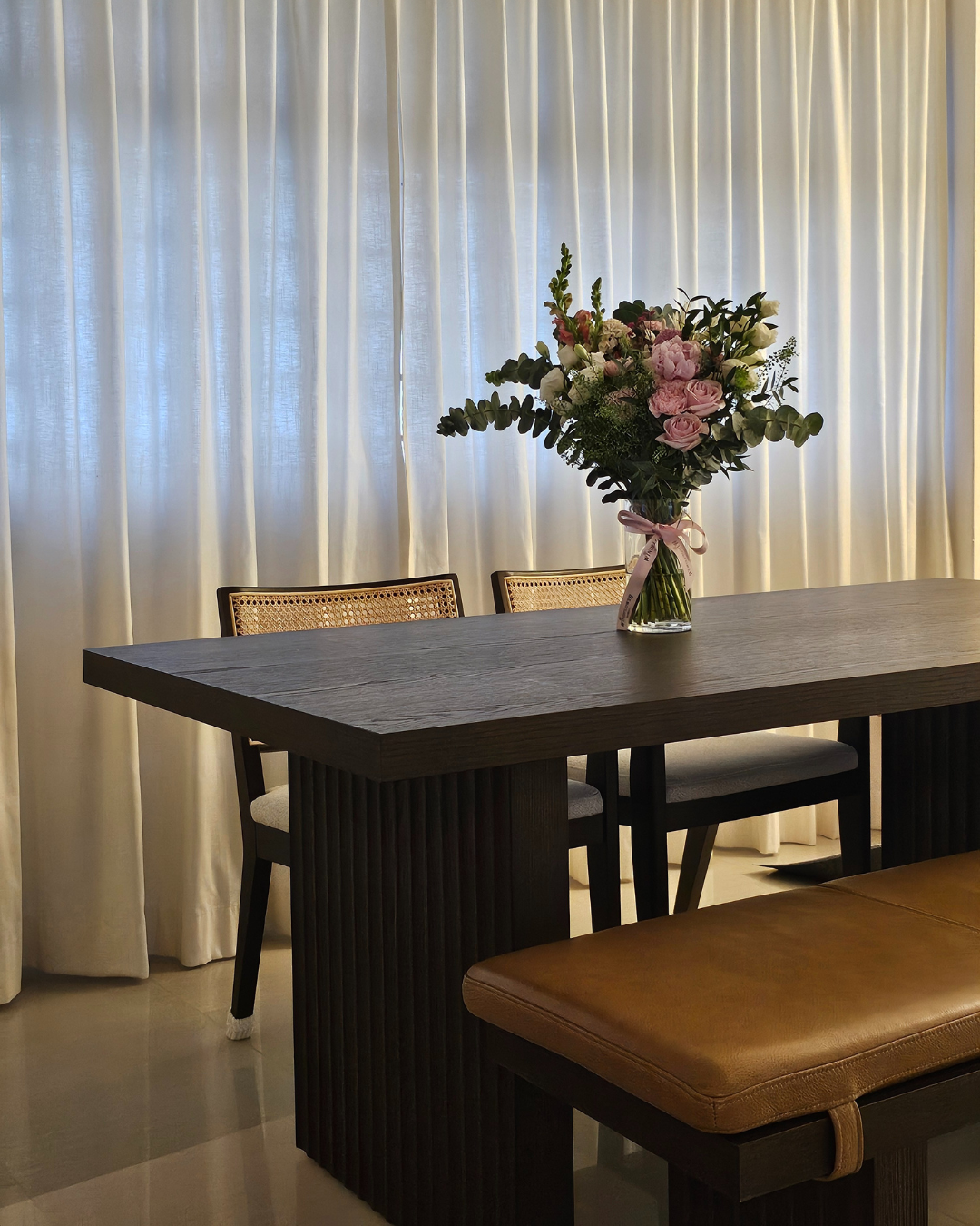 From Before to After: Our Common Area Glow-Up - Creamy white curtains, elegant dining table, wooden table top, modern