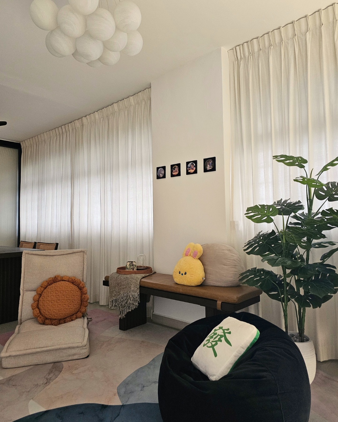 From Before to After: Our Common Area Glow-Up - White sheer curtains, minimalist decor, cozy seating area, plush armchair
