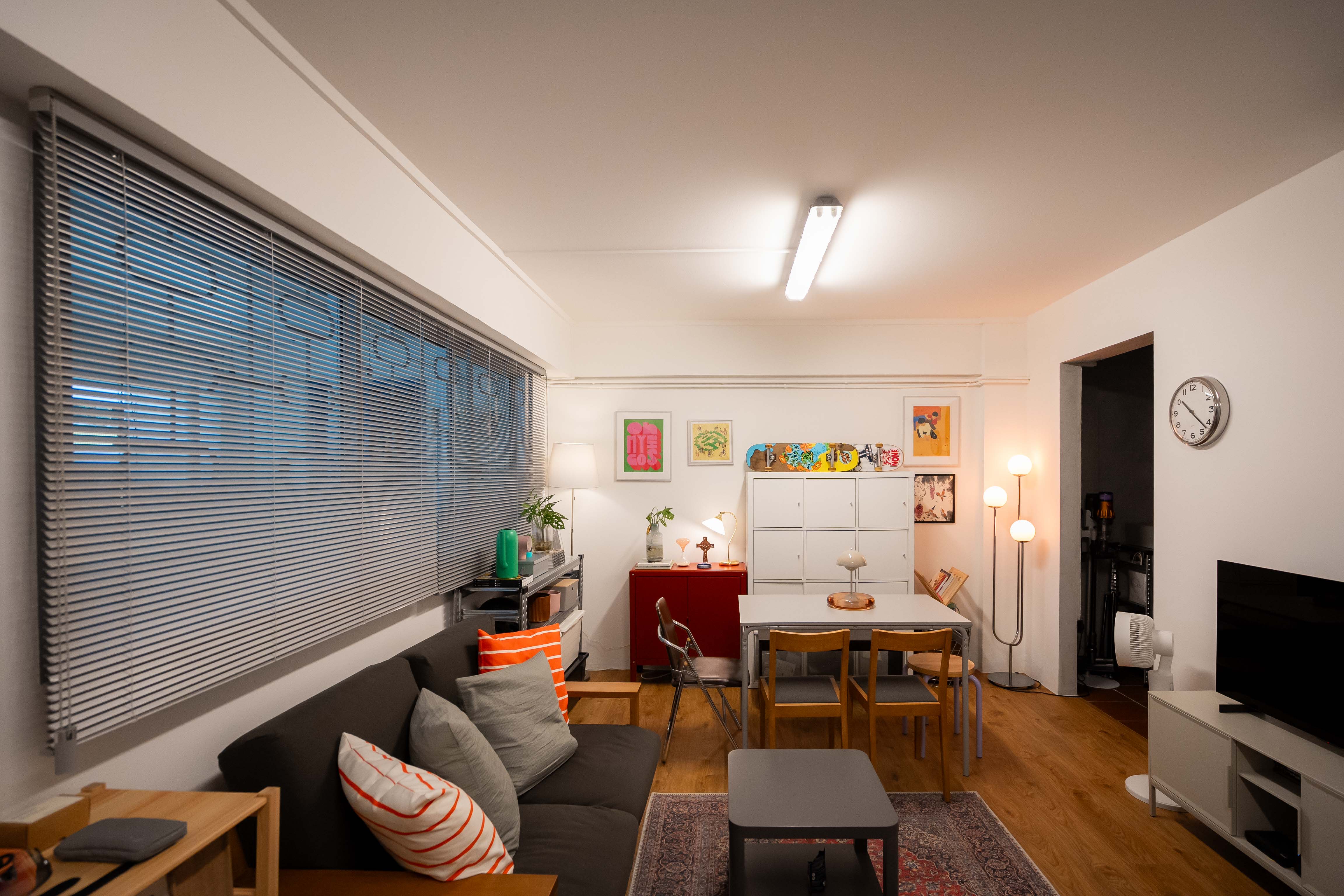 80k 4room HDB transformation: A cosy home photography studio tour! - Modern living room with large windows, wooden floor