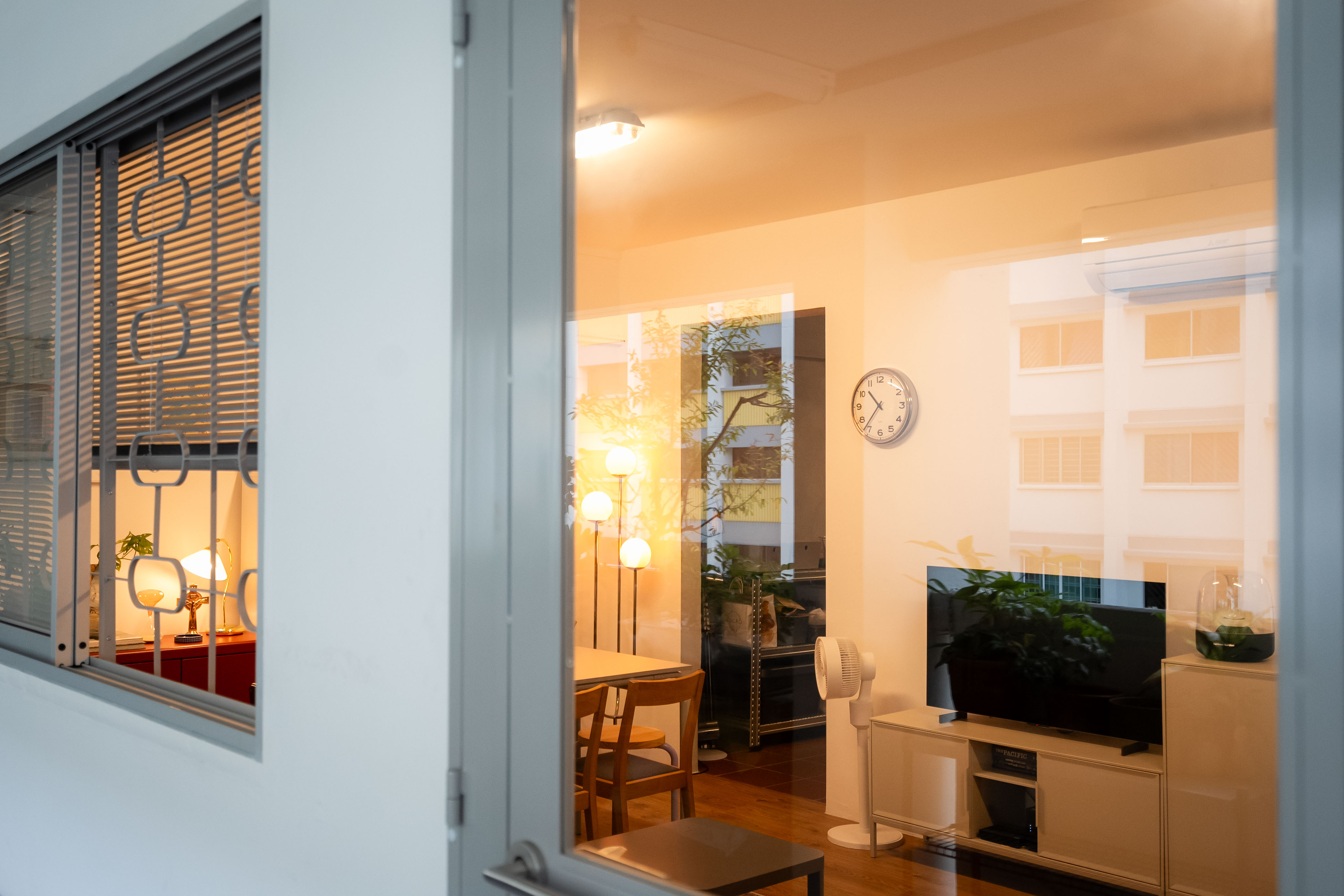 80k 4room HDB transformation: A cosy home photography studio tour! - Modern living room, cozy interior, warm lighting, wooden