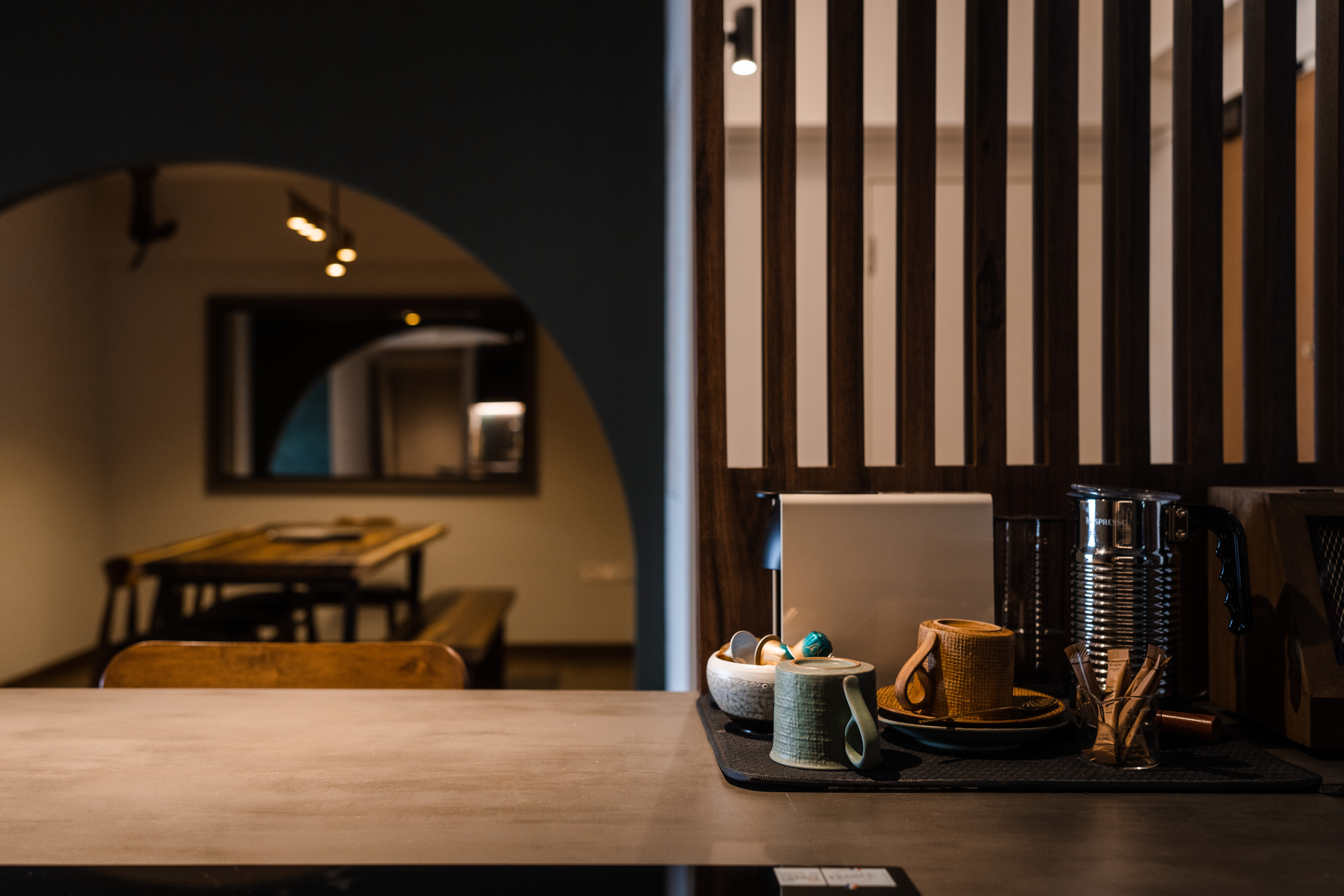 Banter and Bites - coffee shop interior, wooden table, modern decor, minimalist design, cozy atmosphere, coffee machine