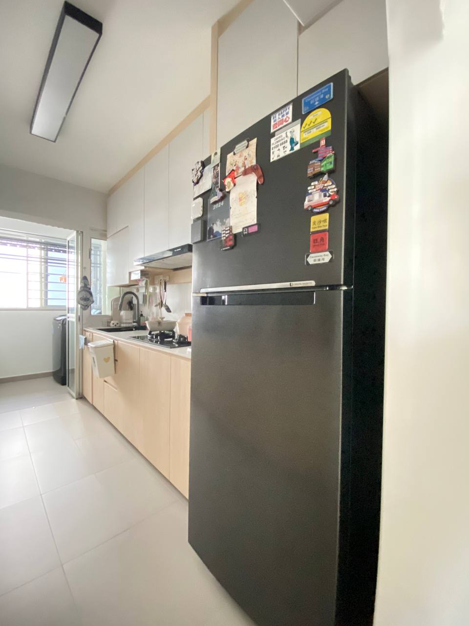 $18,000 Basic Scandinavian BTO in North - Modern kitchen with sleek stainless steel refrigerator, light-colored cabinetry