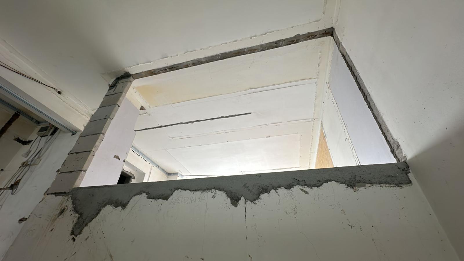 Higher Level Considerations - How We Switch Things Up on Level 2   - White plaster wall, unfinished ceiling, exposed