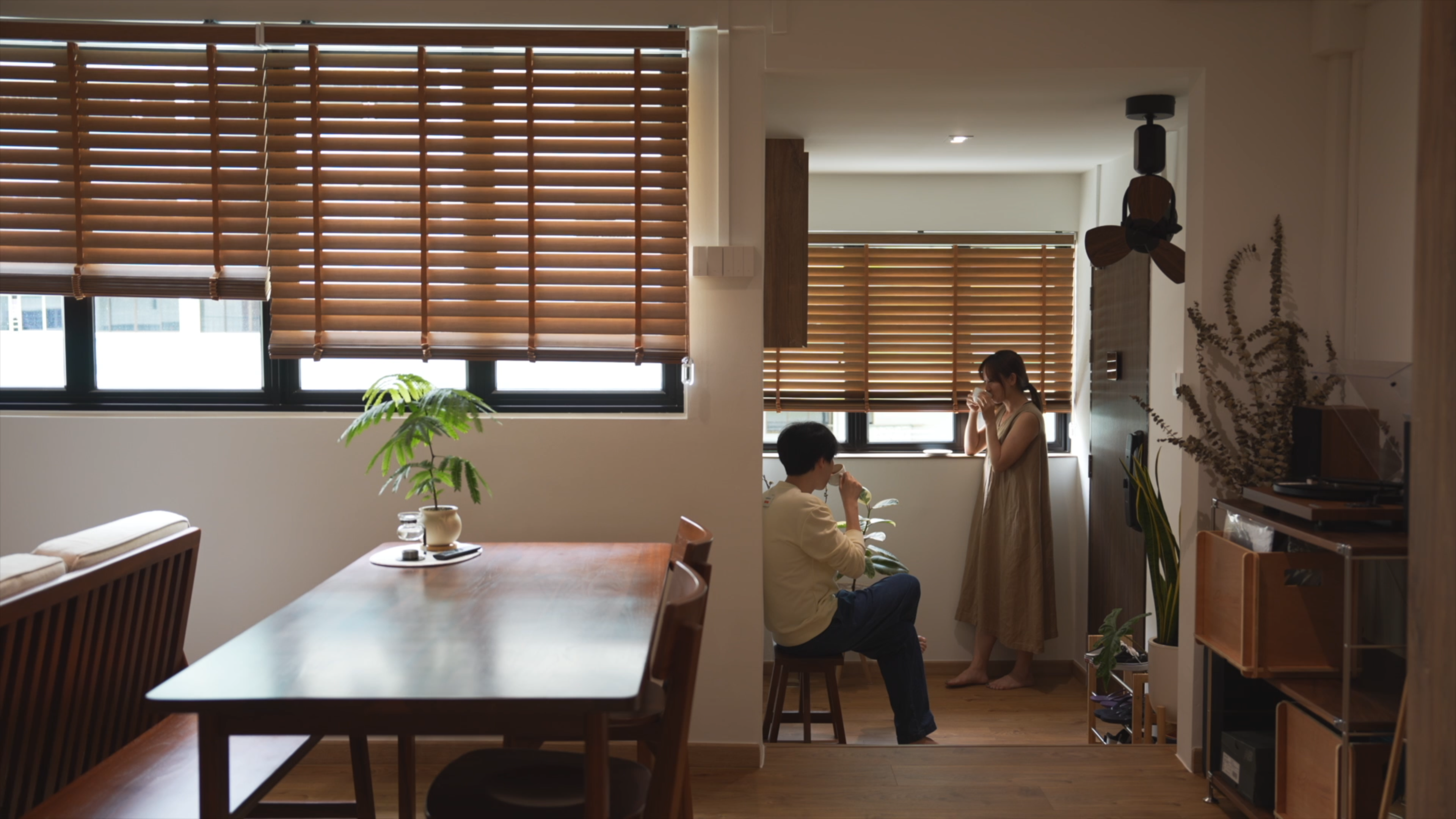 Slow Living at Its Finest: A Tour of Our Thoughtfully Designed Home - Wooden blinds, indoor setting, woman in dress, wooden