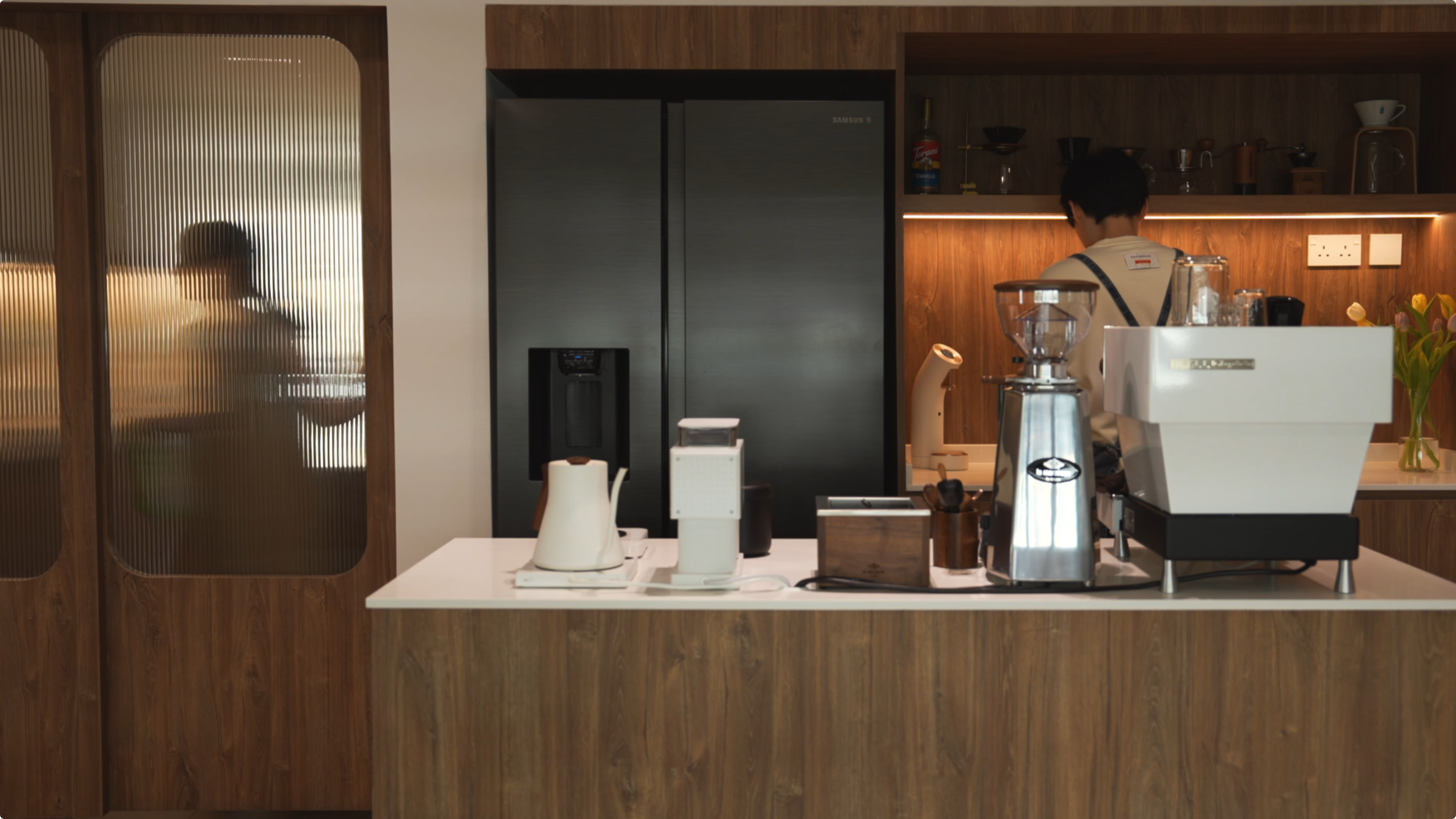 Slow Living at Its Finest: A Tour of Our Thoughtfully Designed Home - Wooden kitchen cabinetry, modern appliances, person