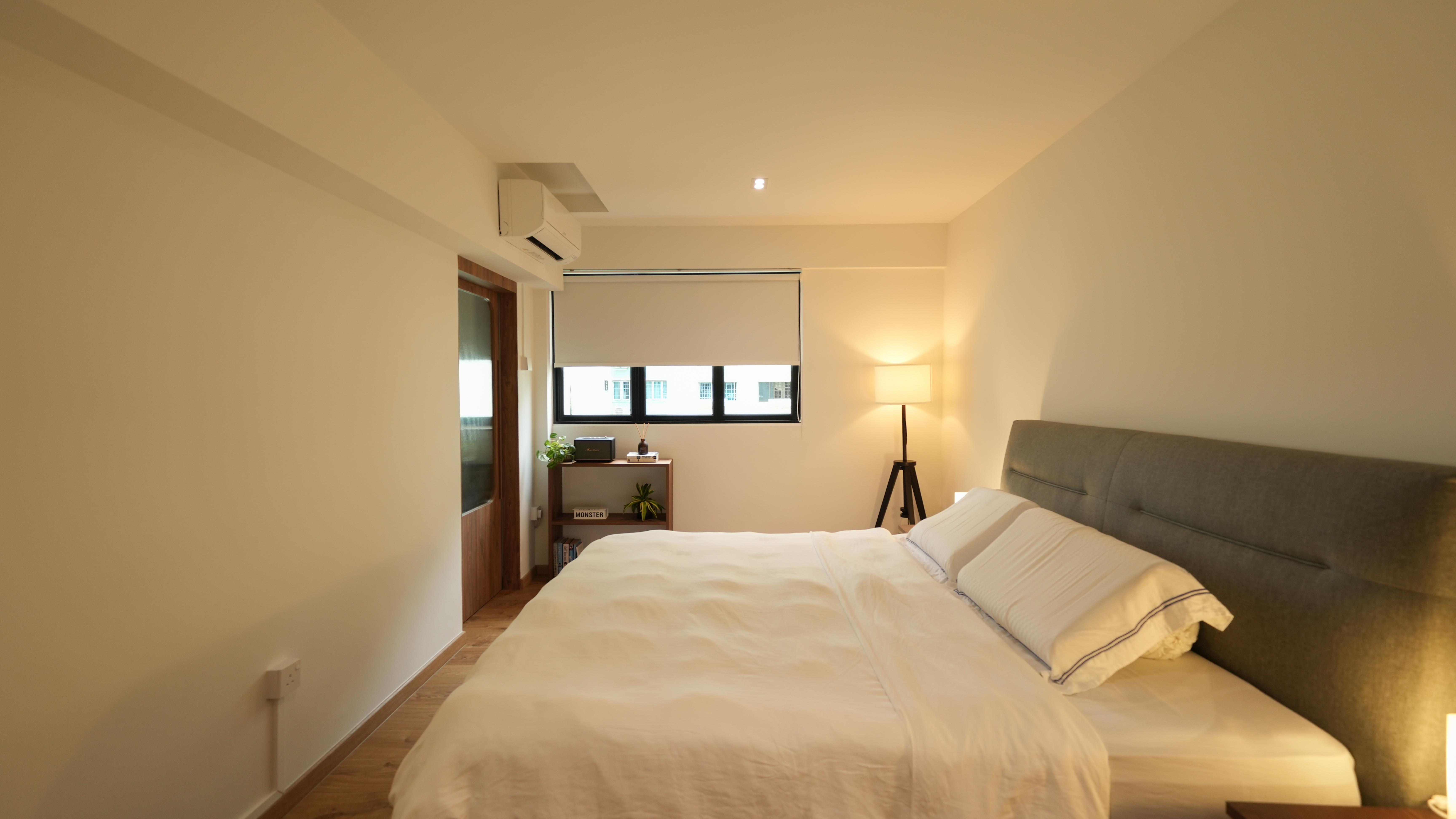 Slow Living at Its Finest: A Tour of Our Thoughtfully Designed Home - Modern bedroom with large bed, beige bedding, wooden