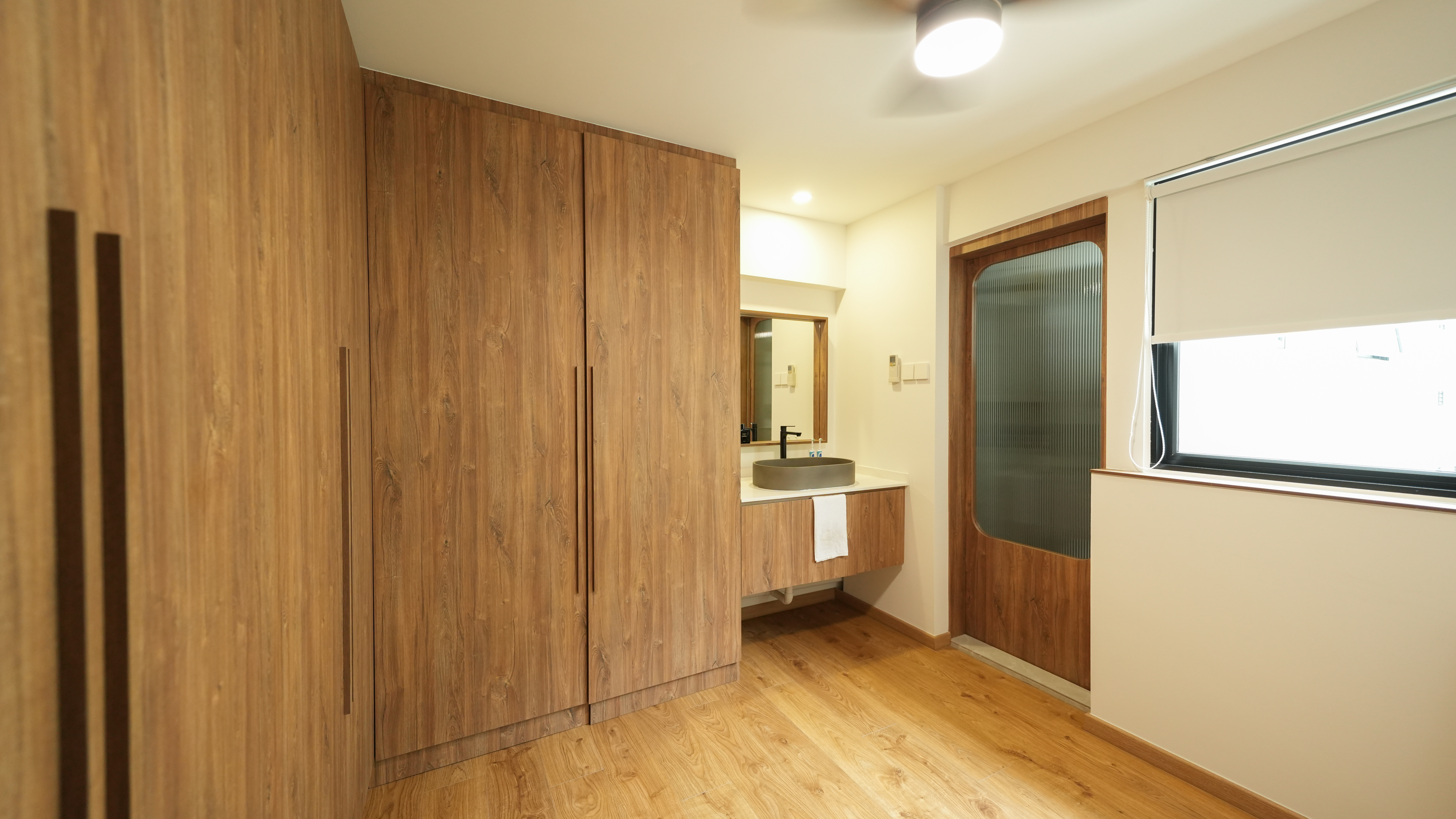 Slow Living at Its Finest: A Tour of Our Thoughtfully Designed Home - Wooden cabinetry, modern design, large mirror, wooden