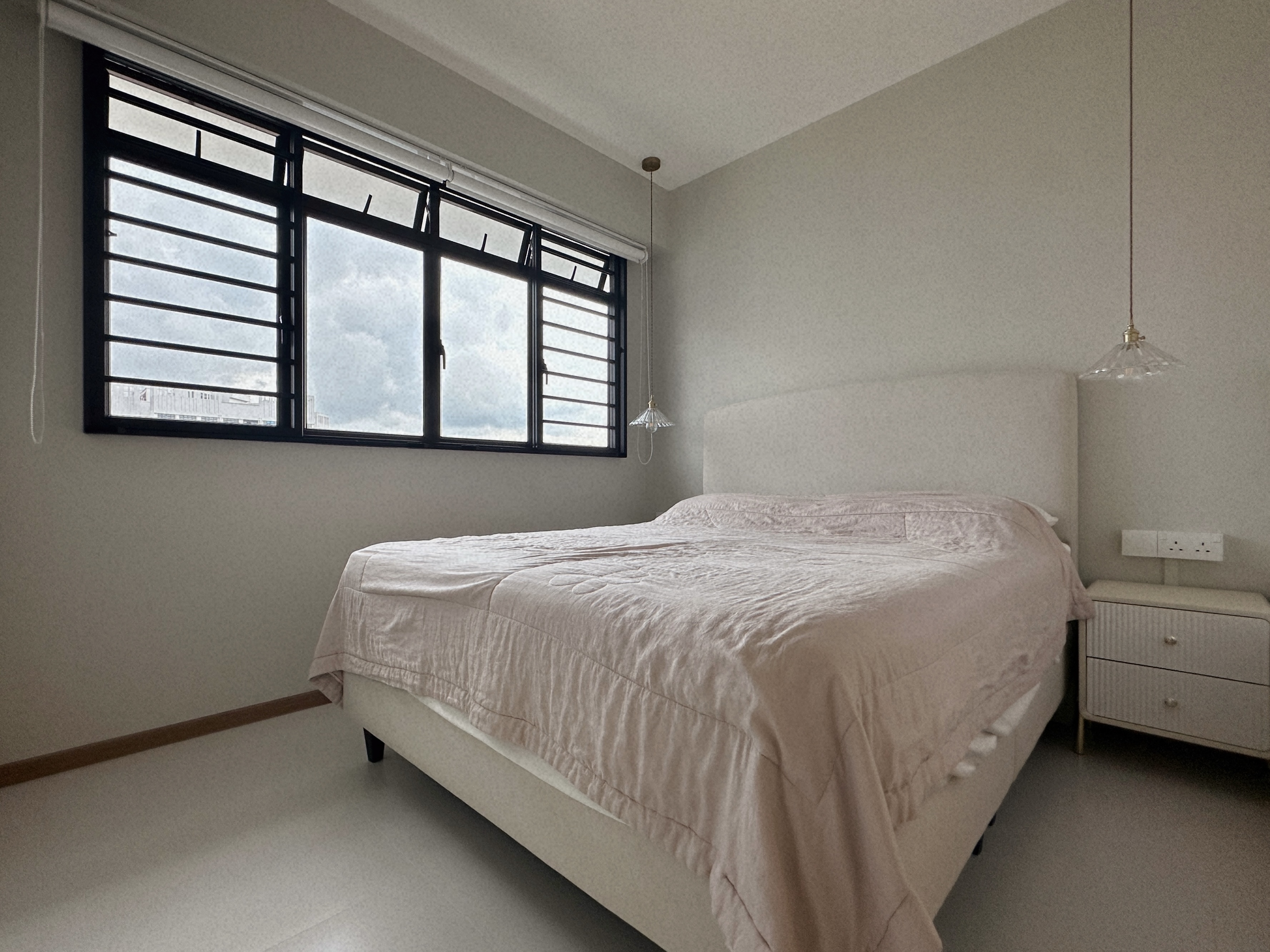 Living Simply, Loving Deeply | Sengkang 4 Room HDB Resale - Modern bedroom with large window, beige bedspread, white
