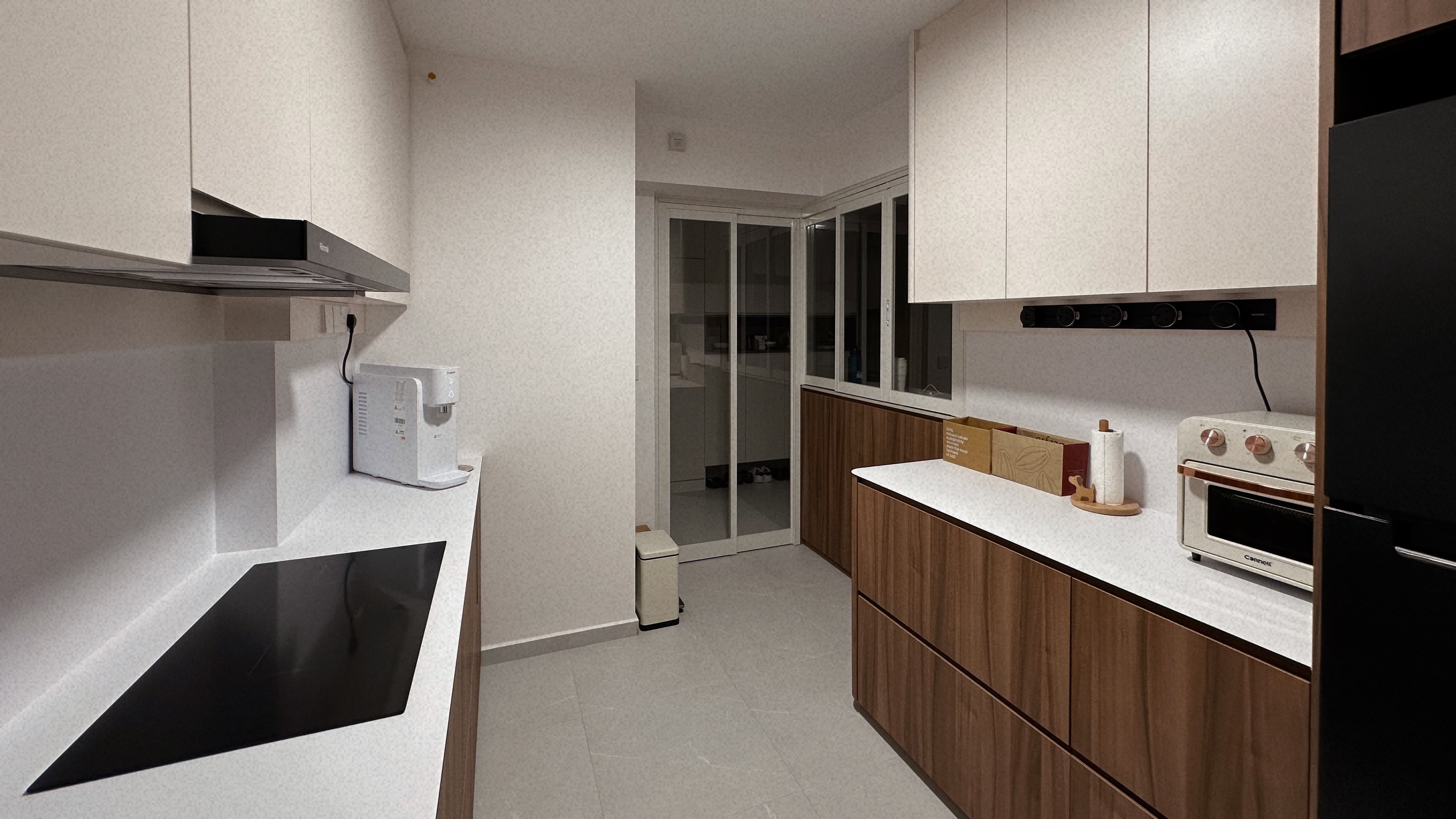 Living Simply, Loving Deeply | Sengkang 4 Room HDB Resale - Modern kitchen with white cabinets and wooden accents, sleek