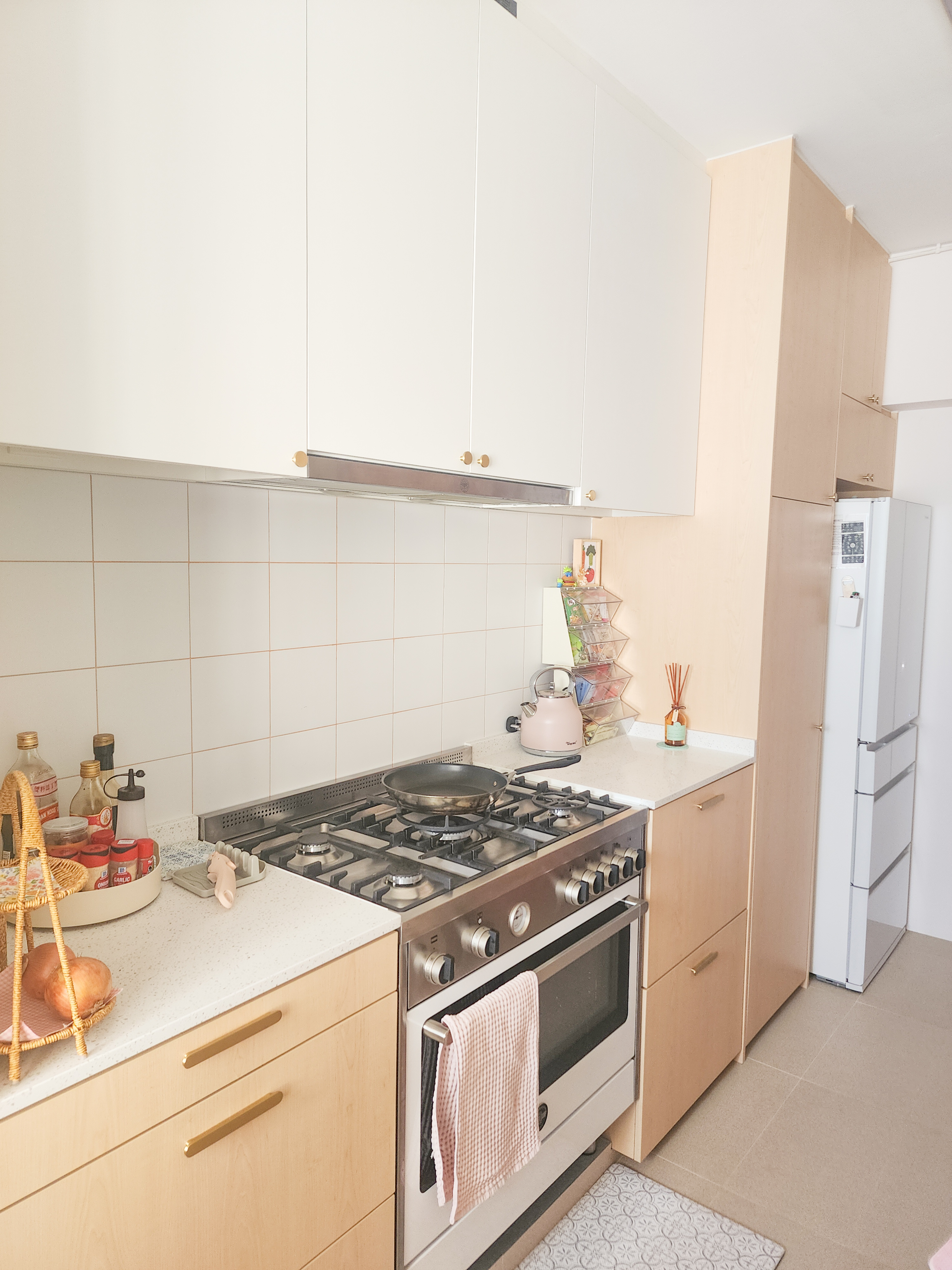 Step inside a chef's kitchen - closed concept, functional & aesthetic - White kitchen cabinets, tiled backsplash, stainless