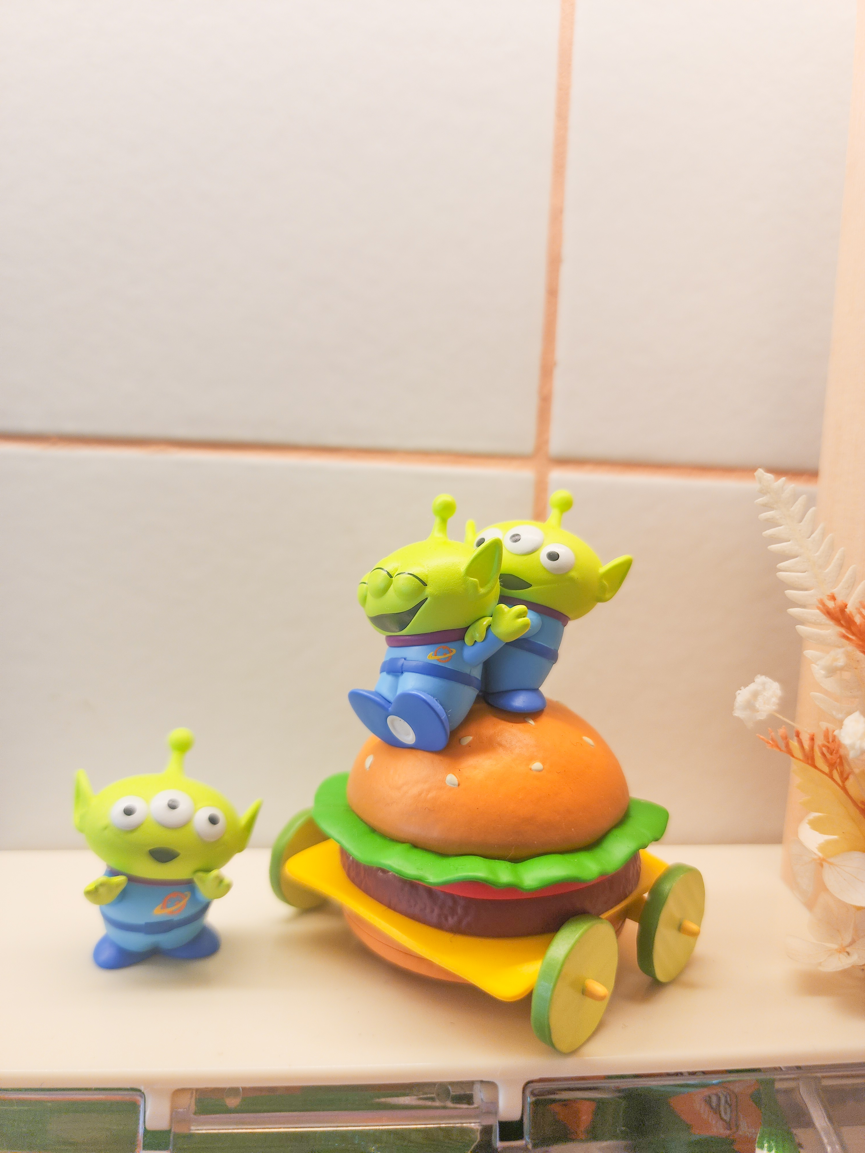 Step inside a chef's kitchen - closed concept, functional & aesthetic - Toy alien figures with large eyes and small arms
