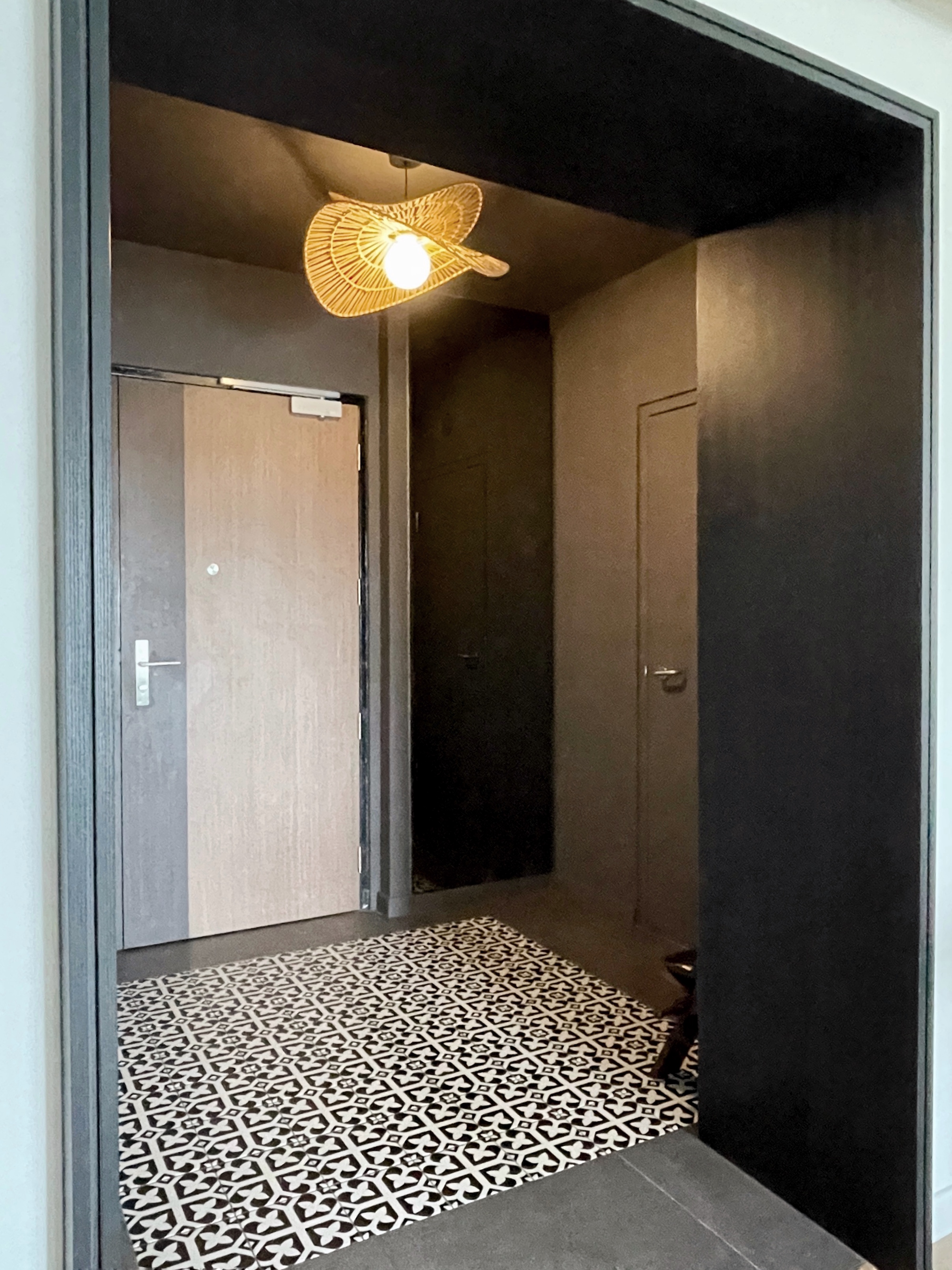 Entryway: A dark, moody space Decompression Chamber - Modern hallway, minimalist design, geometric pattern, black and white