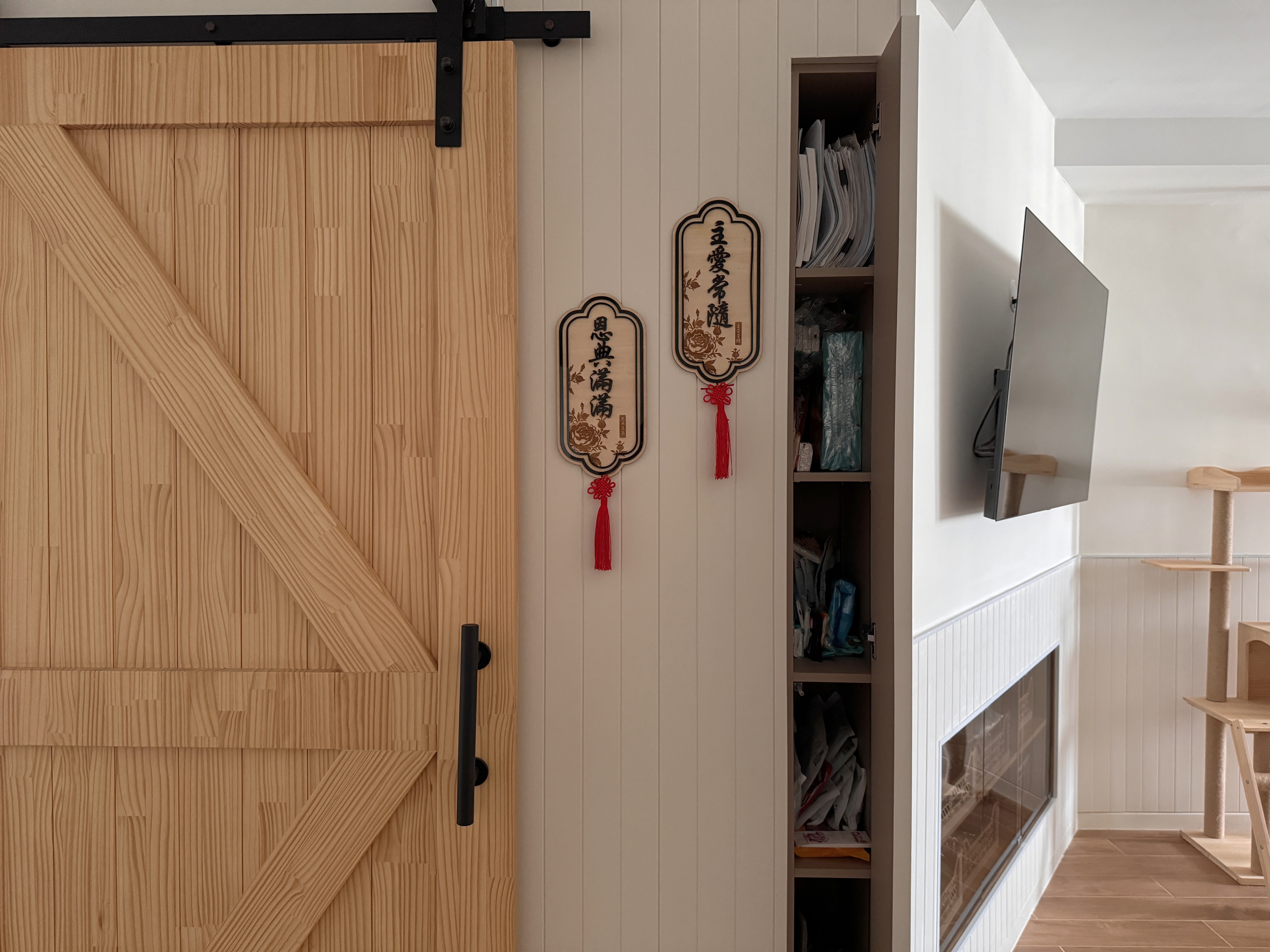 Earthy Entryway with Pops of Color: Ditching the built-in shoe cabinet - Wooden door with black metal hinges, beige wooden