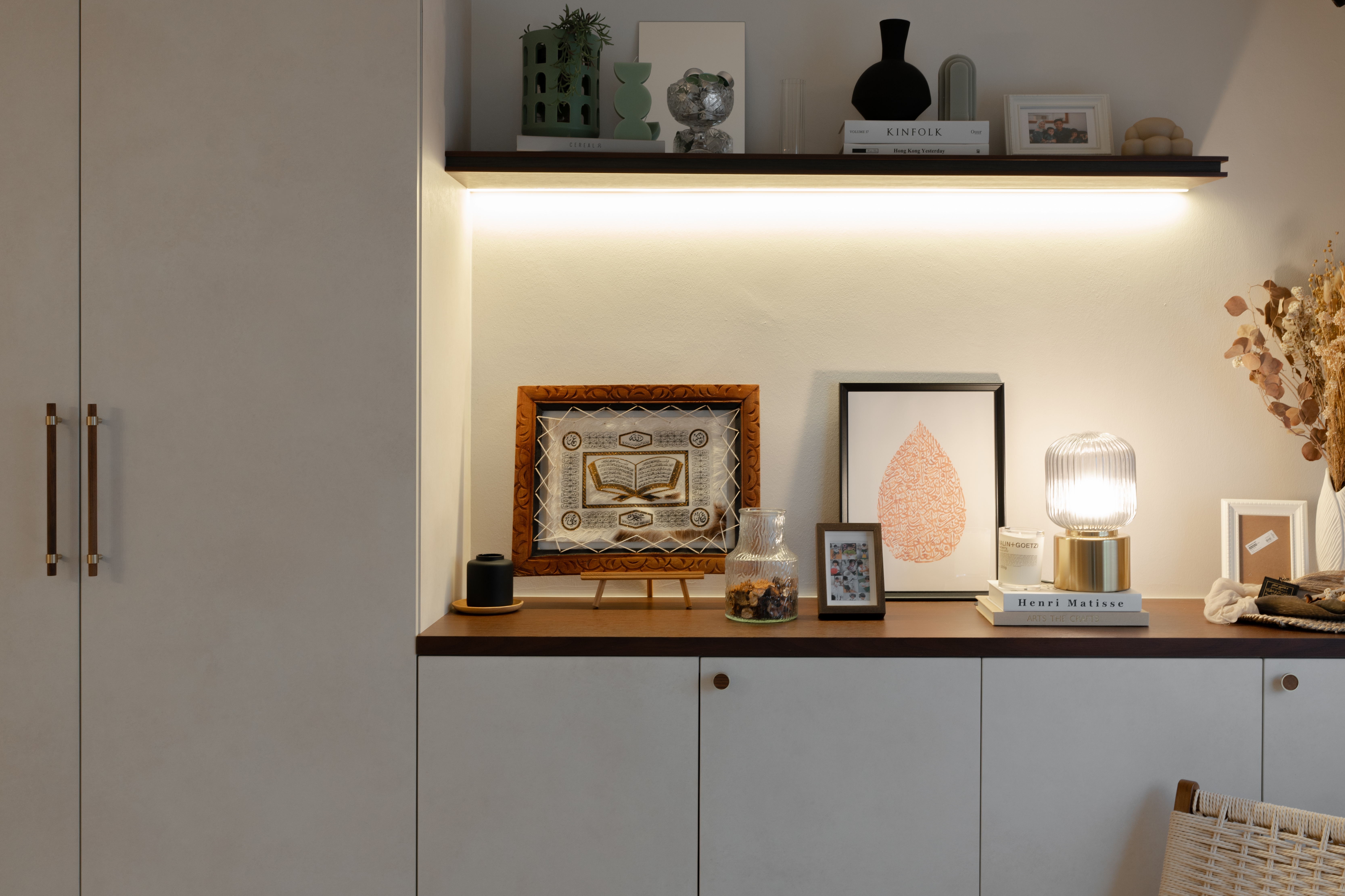 Entryway Essentials: Style, Storage and a touch of our personality! - Shelf with various decorative items, including framed