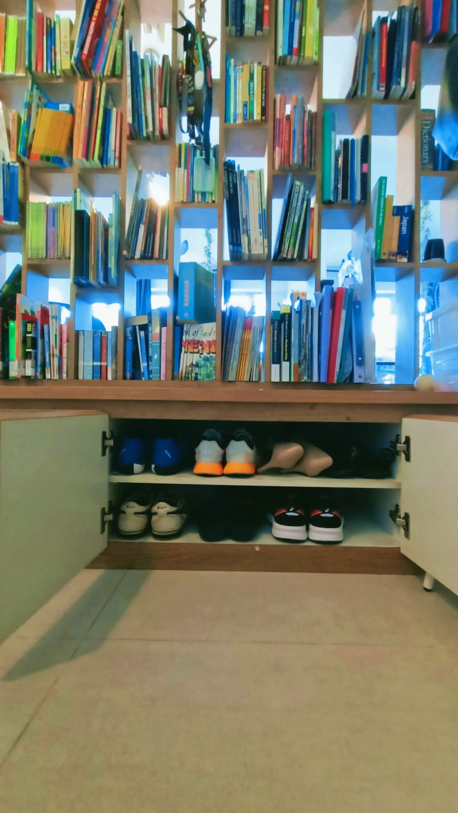 Cozy Entryway: Less is More in this Rustic Cozy Home - shelves, books, organized, bookshelf, colorful books, open closet