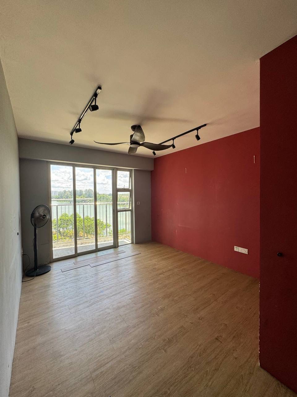 Our House-Hunting Journey: Finding 'the One' or Not? - Modern open-plan living space with large windows, wooden flooring, red