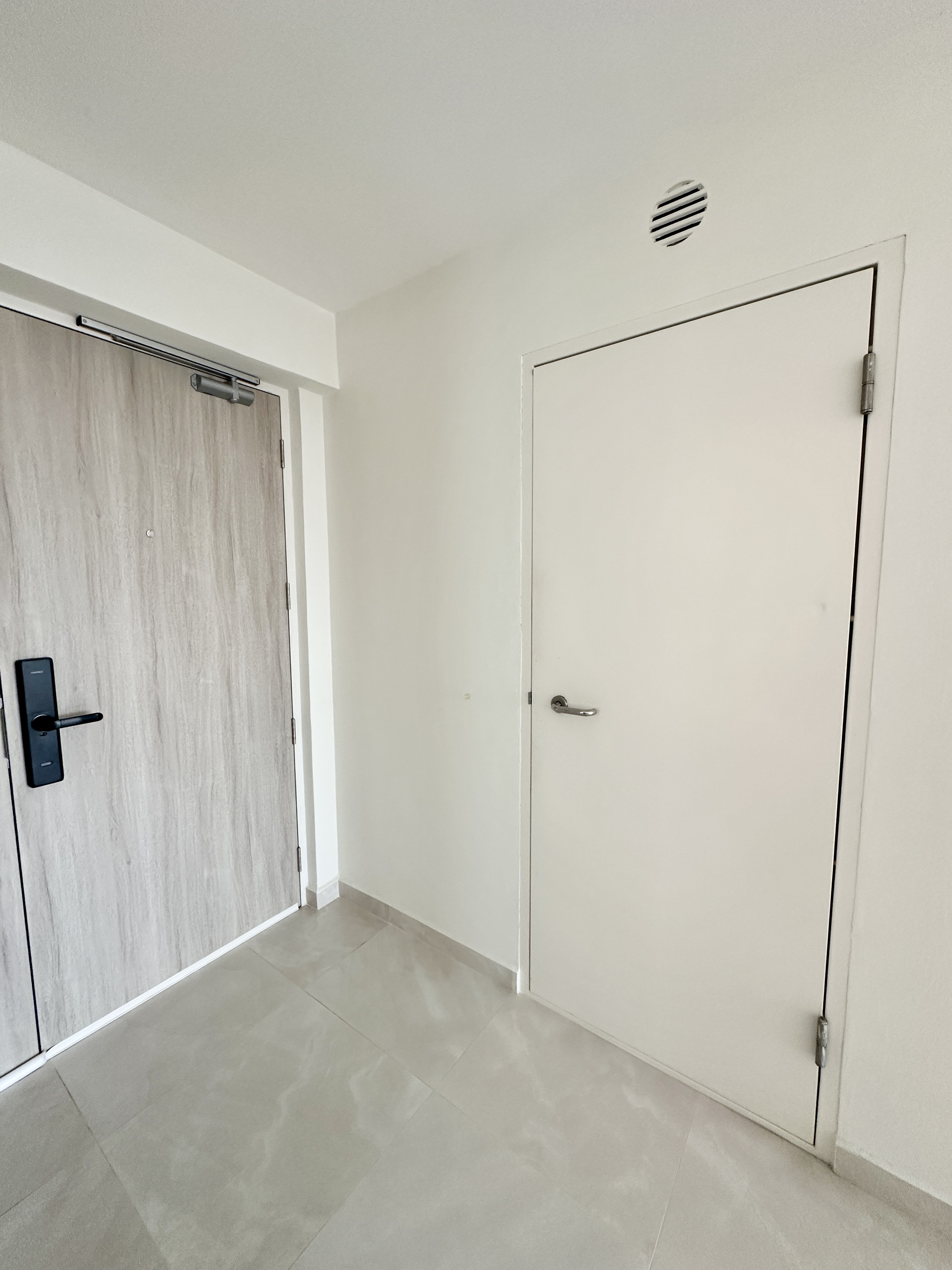Functional Storage Solutions: A Peek into Our Simple Entryway - Wooden door, white walls, tiled floor, modern design