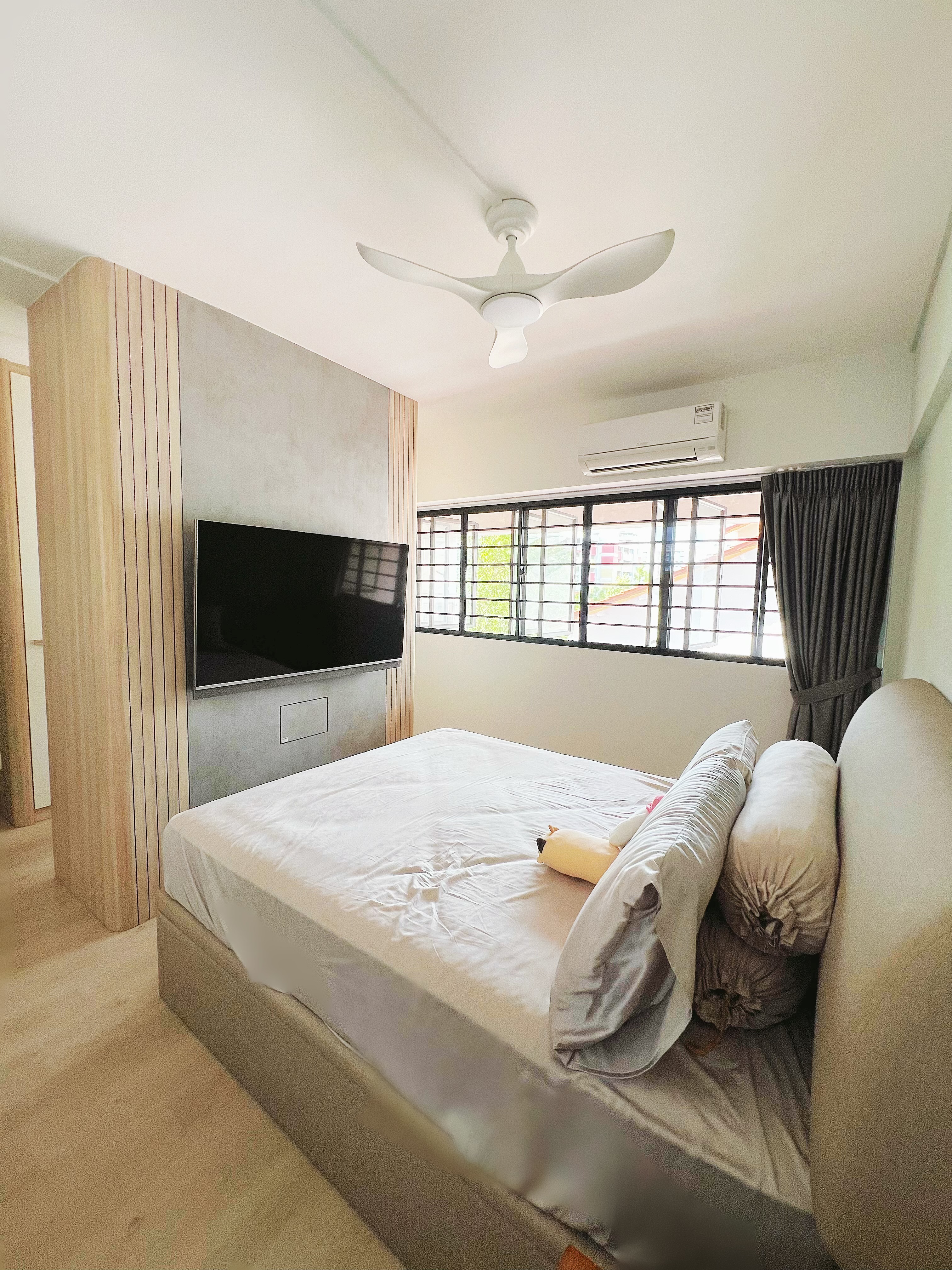 Cozy minimalist master bedroom with walk-in wardrobe