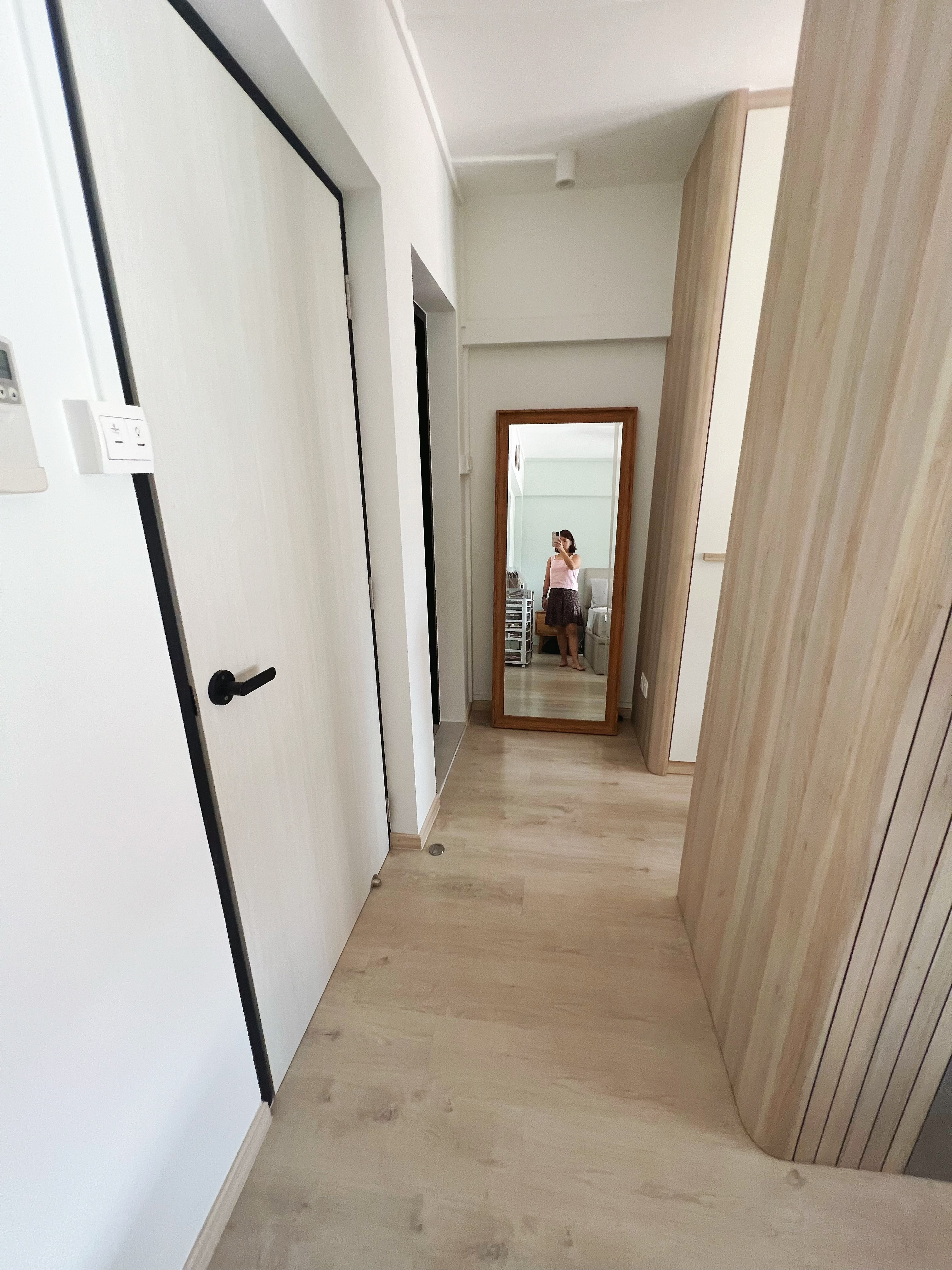 Cozy minimalist master bedroom with walk-in wardrobe