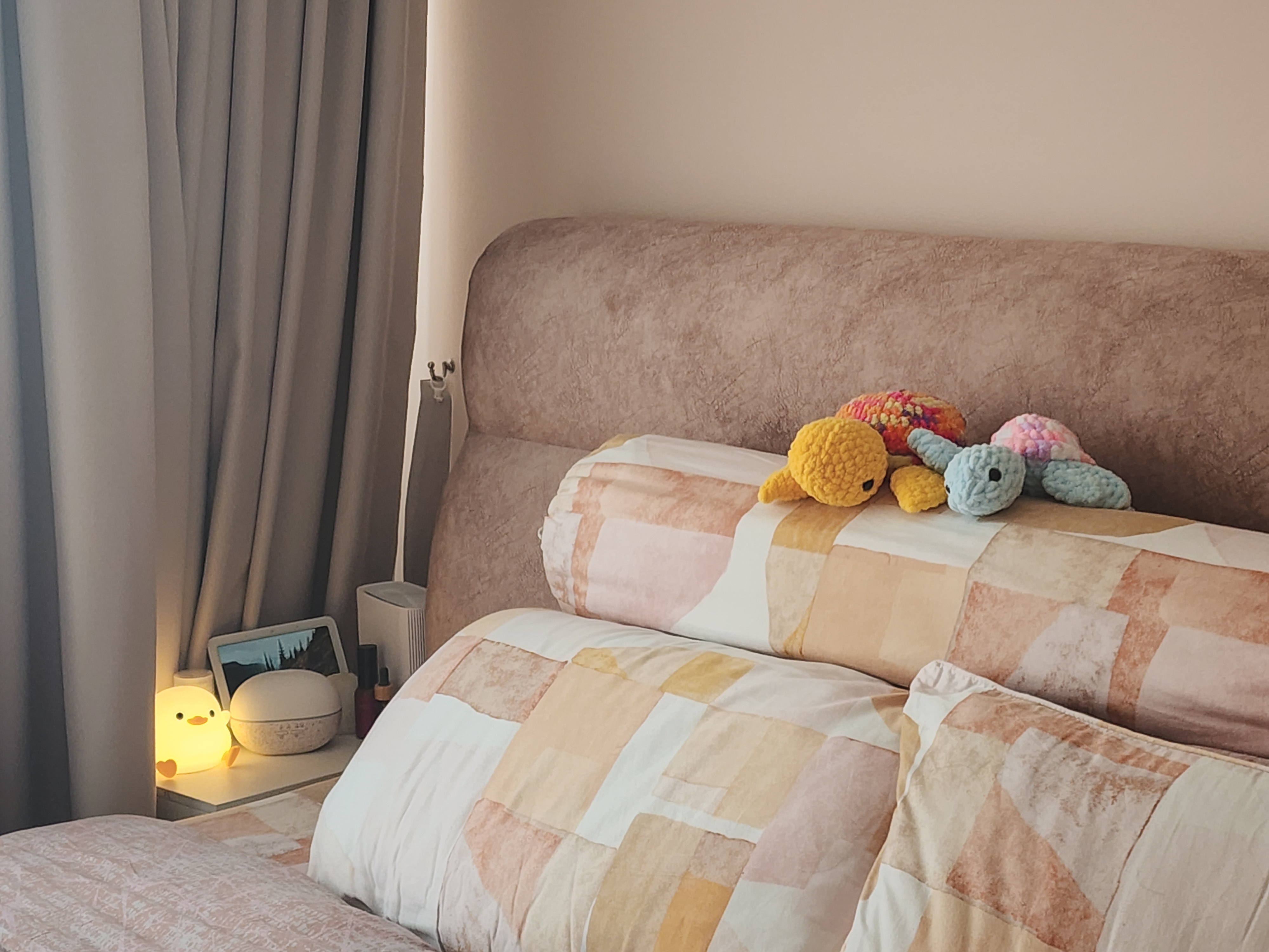 A cosy bedroom with warm neutral tones and a semi walk-in wardrobe