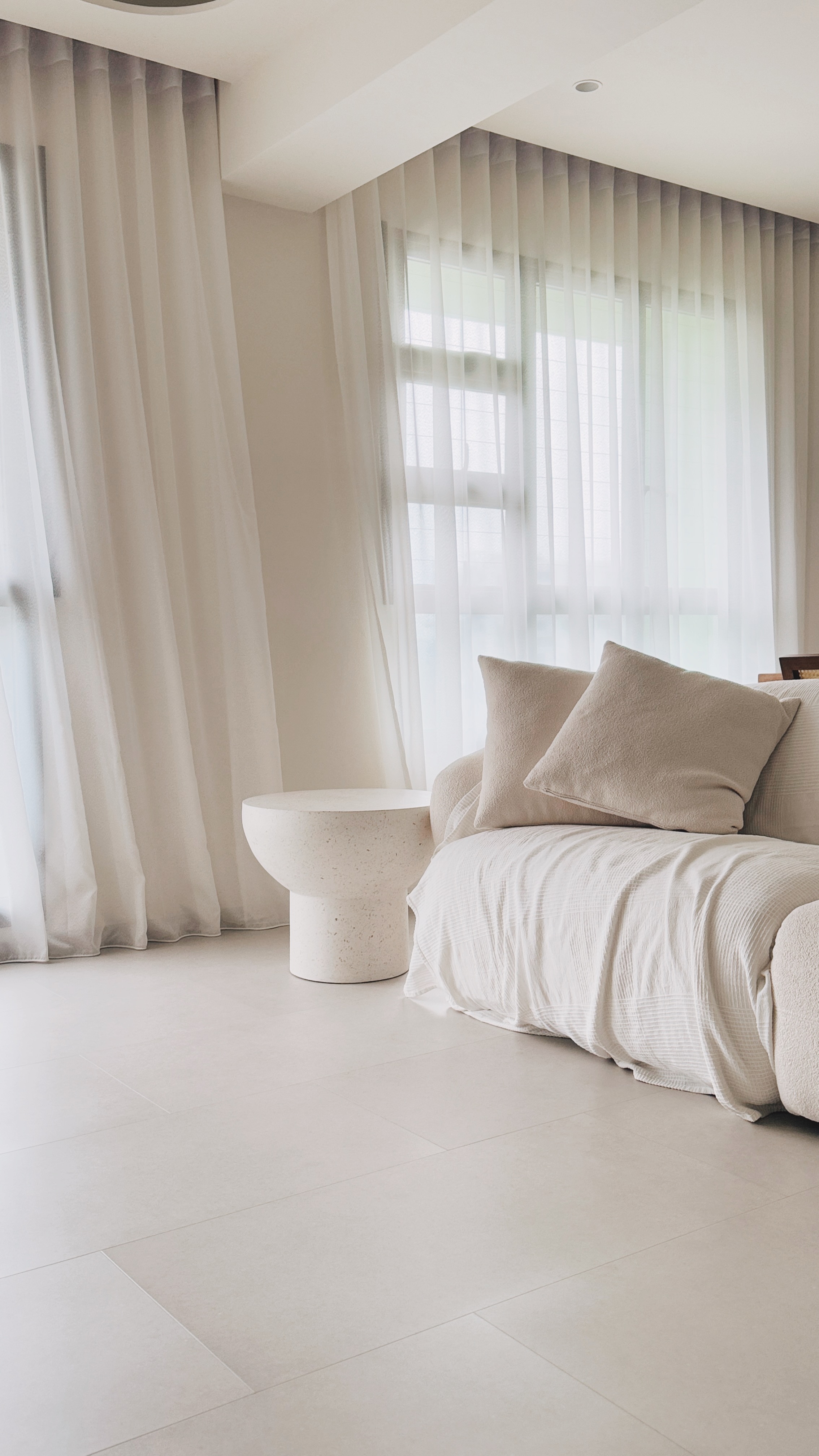 Serene & minimalistic living space with soft textures & natural tones