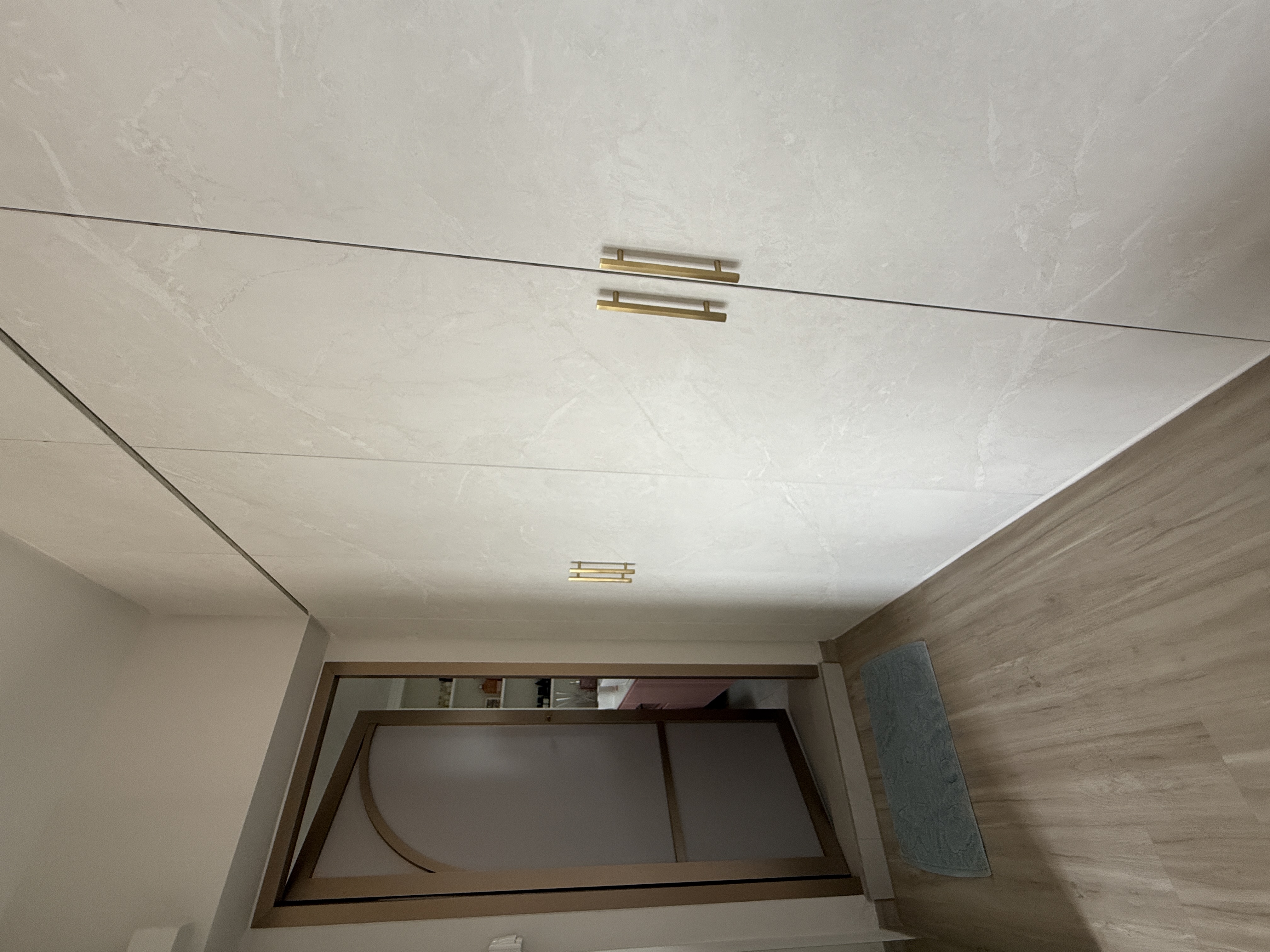 Luxury MBR with vanity island and curves in bronze