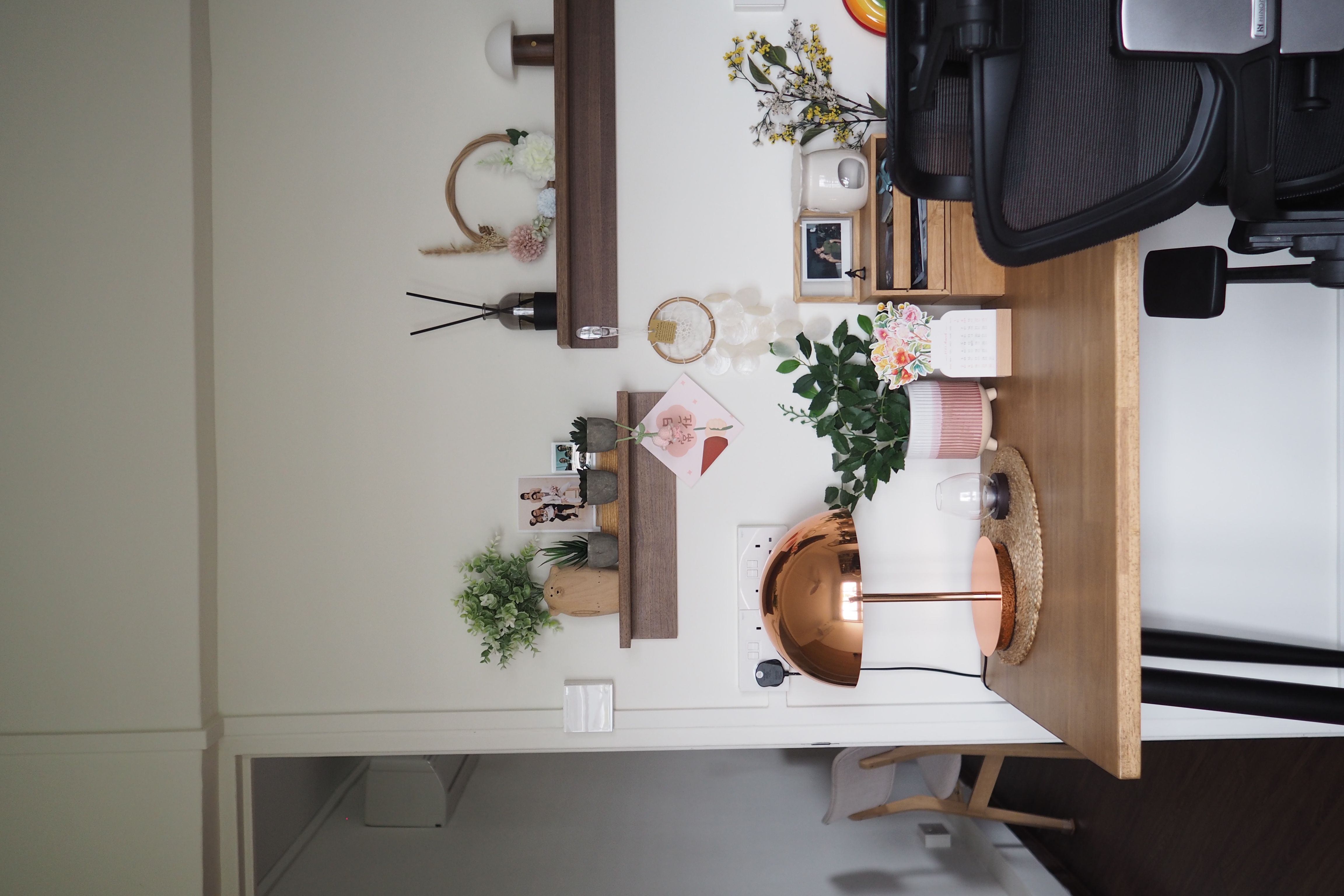 Home workspace with lots of knick knacks 🪴