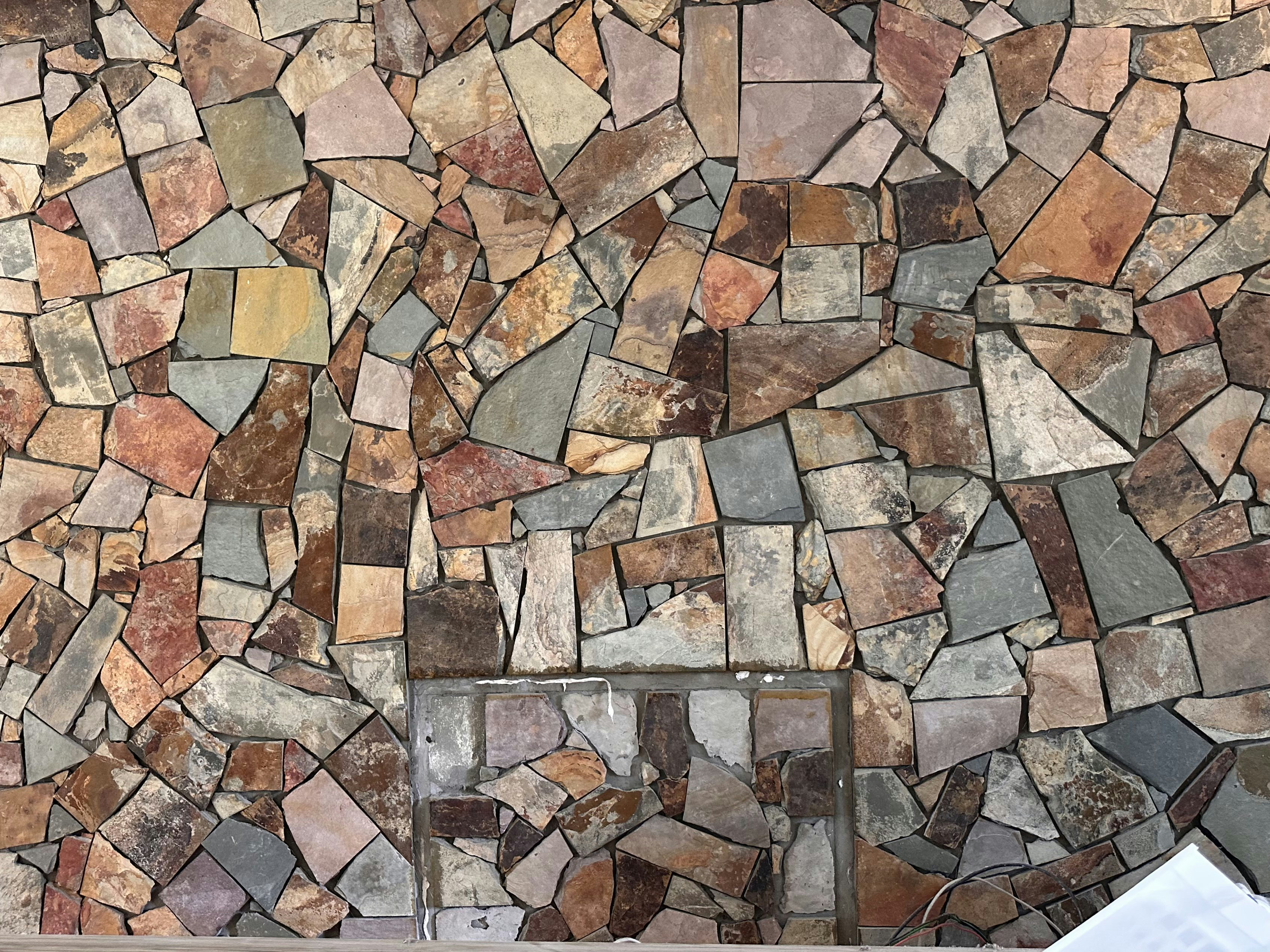 Before After of our DIY stone wall-farmhose on a budjet