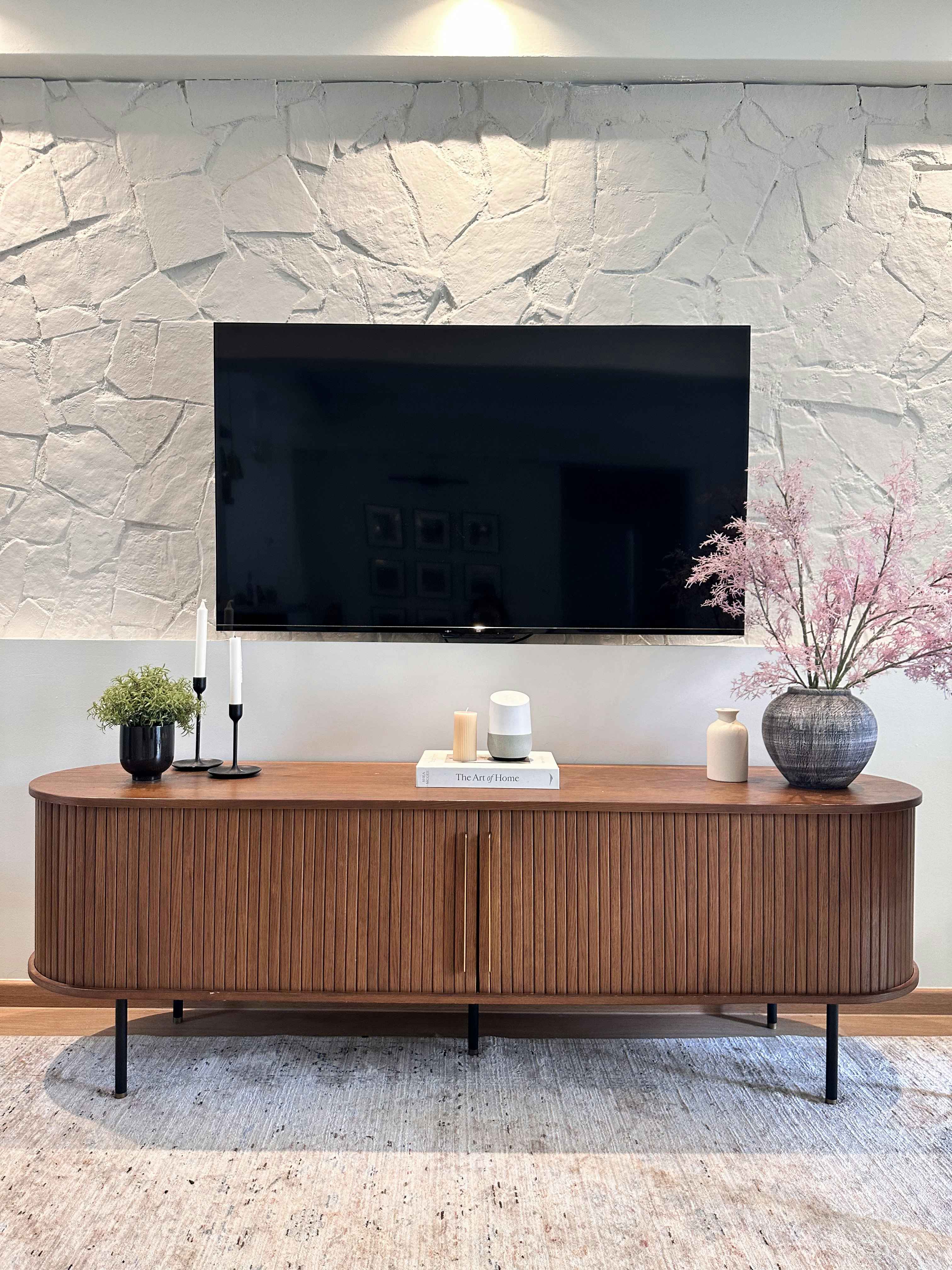 Before After of our DIY stone wall-farmhose on a budjet