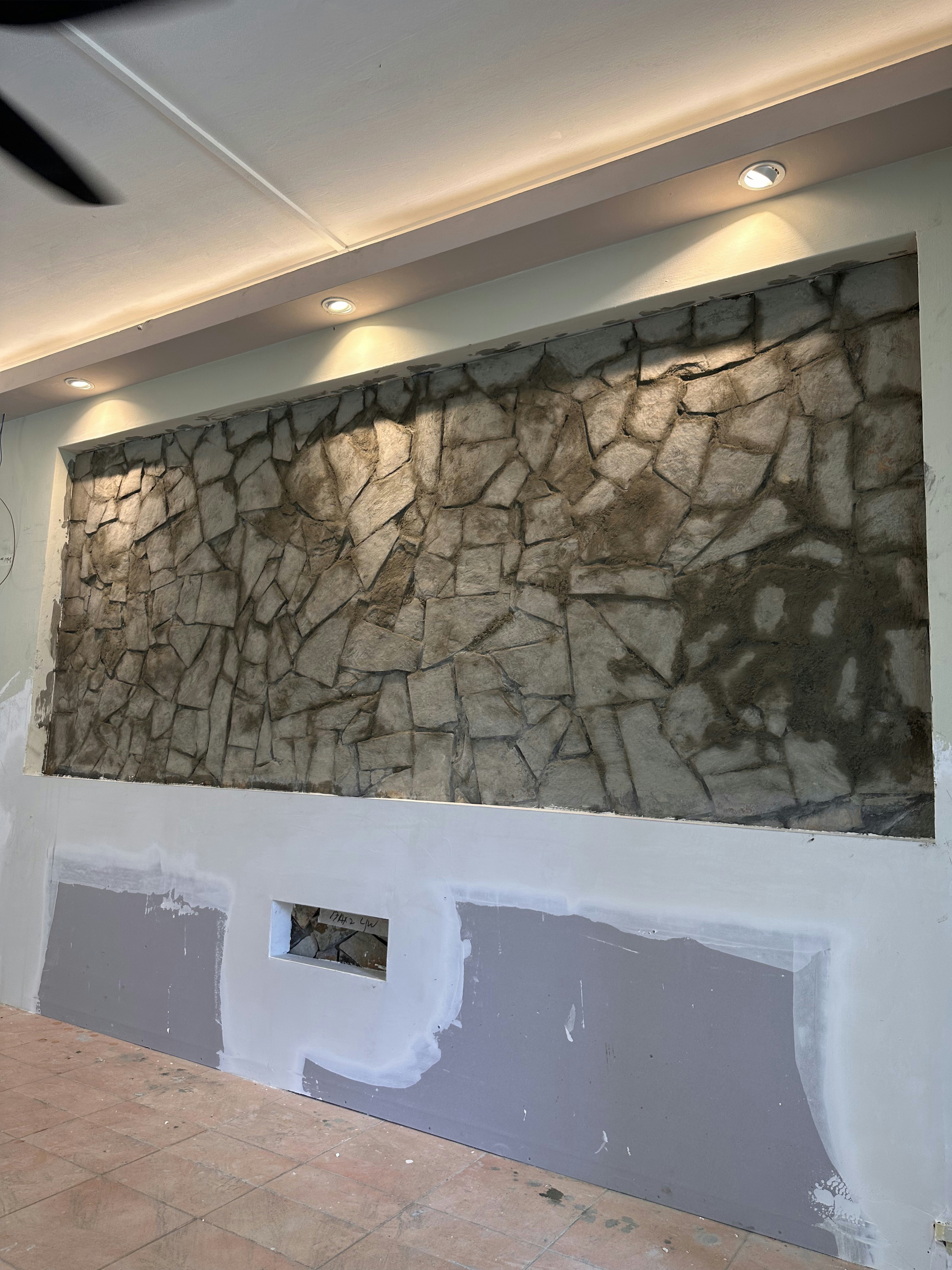 Before After of our DIY stone wall-farmhose on a budjet