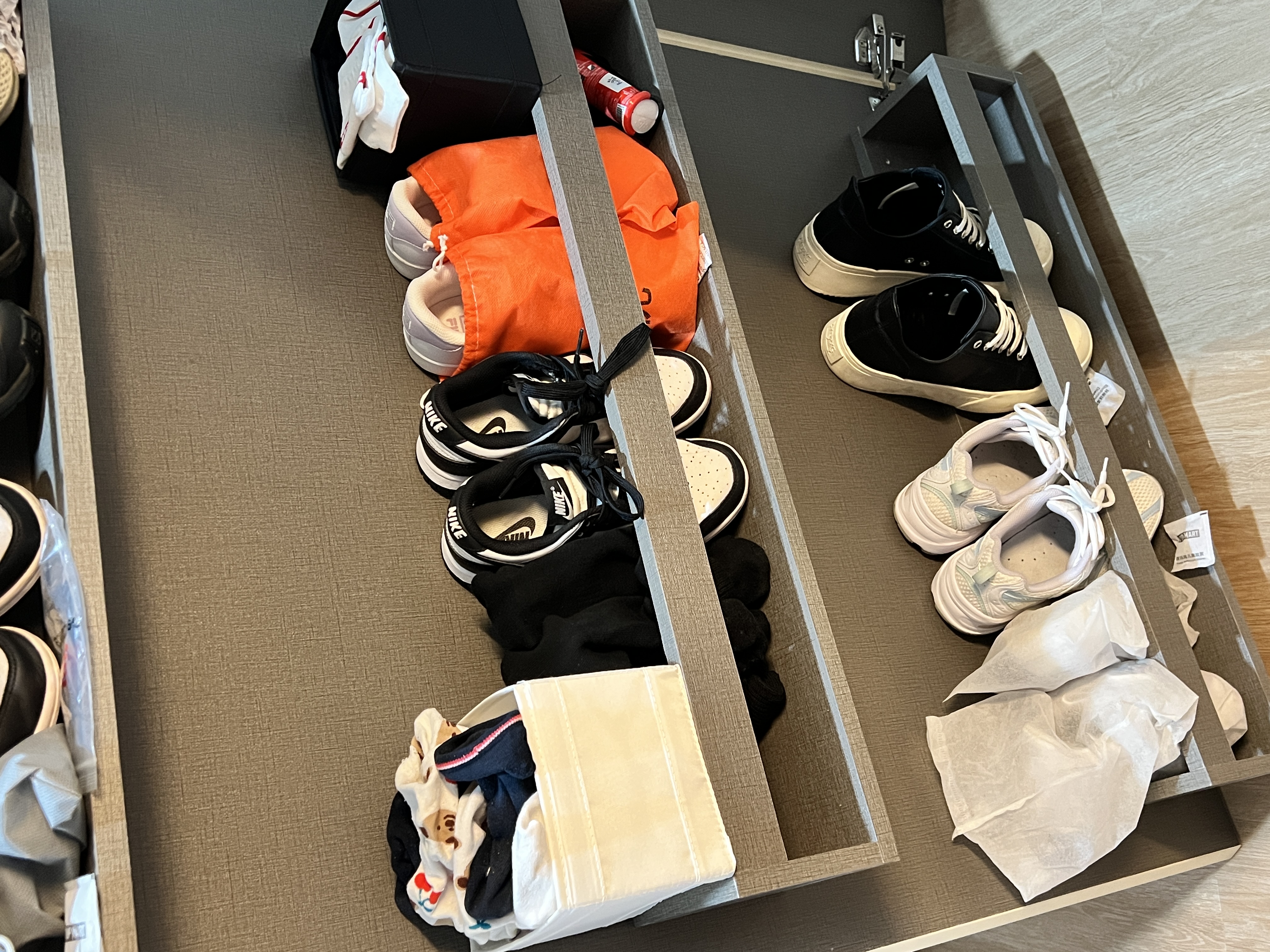 Easily accessible shoe shelves behind bomb shelter door